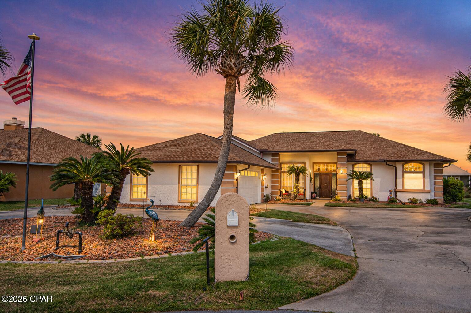 3BR/2.5BA home in The Glades in Panama City Beach. Pond-front with screened heated pool. Roof & AC 2019, appliances 2024-25.  This 3 bedroom, 2.5 bath home with office in The Glades offers a 2,190 sq ft layout designed for full-time living or second-home use in Panama City Beach. Built in 1994 and located on a cul-de-sac south of Highway 98, the property sits on a freshwater pond with a screened, heated pool and extended lanai for outdoor use. The quiet dead-end street offers limited through traffic.  Key updates include a roof and HVAC replaced in 2019, two water heaters installed in 2020 and 2021, and kitchen appliances updated between 2024 and 2025.  The interior features a split floor plan with 10-foot ceilings throughout the home. The kitchen includes updated appliances, tile backsplash replaced in 2025, breakfast bar, and adjacent dining and breakfast areas. The primary suite includes private lanai access, mini-split AC, two walk-in closets, double vanity, makeup station, and a large walk-in shower with dual shower heads. Two guest bedrooms have new carpet and lighting, and a dedicated office supports work-from-home needs. The home has been extensively remodeled, well maintained, and kept in meticulously clean condition over time.  System improvements focus on long-term ownership confidence. The home includes central air plus a mini-split system, propane fireplace, hurricane shutters, termite bond, and a portable generator connection. The portable generator conveys with the home. The property is pre-piped for future gas service if introduced to the neighborhood.  Outdoor features include a screened in-ground pool heated by propane or solar, with a lanai extended 9 feet to add a sunning area. The backyard landscaping is well maintained, and the pond setting provides beautiful open water views. Most patio furnishings convey with the property, allowing the next owner to immediately enjoy the outdoor living spaces.  The lot includes a circular driveway with parking for up to five vehicles, a two-car garage, and a golf cart garage with separate entrance and exit.  Located in The Glades, a golf cart-friendly community in central Panama City Beach, the home provides access to shopping, dining, and beach routes within a short drive. The HOA is $550 annually and includes twice-weekly trash collection, semi-annual bulk item pickup, and Flock security camera coverage at all three neighborhood entrances. Short-term rentals are not permitted, supporting a more residential environment.  Additional practical details include negotiable furnishings, all window coverings conveying, most patio furniture conveying (excluding one umbrella), attic access in the garage, and immediate occupancy availability. The home is offered as-is.