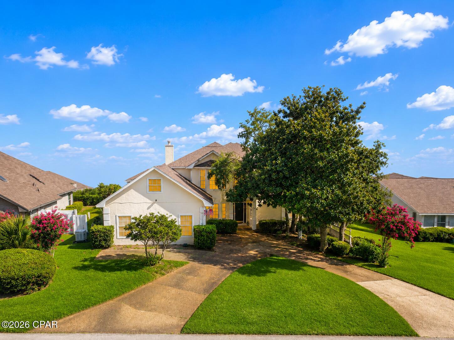 MOTIVATED SELLER! Bring All Offers! New Pool Filer!  Stately Bay Point pool home with screened lanai on quiet cul-de-sac! 2,800 + sq. ft.  with side entry garage and golf cart parking as well as  circular driveway and Generac Generator! Totally remodeled and updated including kitchen and all baths!  This spacious home offers lots of storage and natural light with an open floorplan.  Beautifully updated kitchen with granite/stainless/coffee bar, double ovens and lots of cabinetry.  Living area overlooks pool with woodburning fireplace and separate dining room.  Kitchen nook for dining area that opens to family room and wetbar offering sink and fridge.  Master bedroom downstairs off living room overlooks pool too!  All tile laid on diagonal downstairs for easy maintenance with master bedroom offering beautiful hardwoods.  Master bath has garden tub and separate shower plus large walk-in closet with door to pool.  Upstairs you'll find two spacious bedrooms, guest bath and bonus room over the garage.  Bay Point offers a marina, dining, championship golf, gated entry with 24-hour security  and is conveniently located close to Grand Lagoon, waterfront dining, Shell Island and award-winning waterfront restaurants.