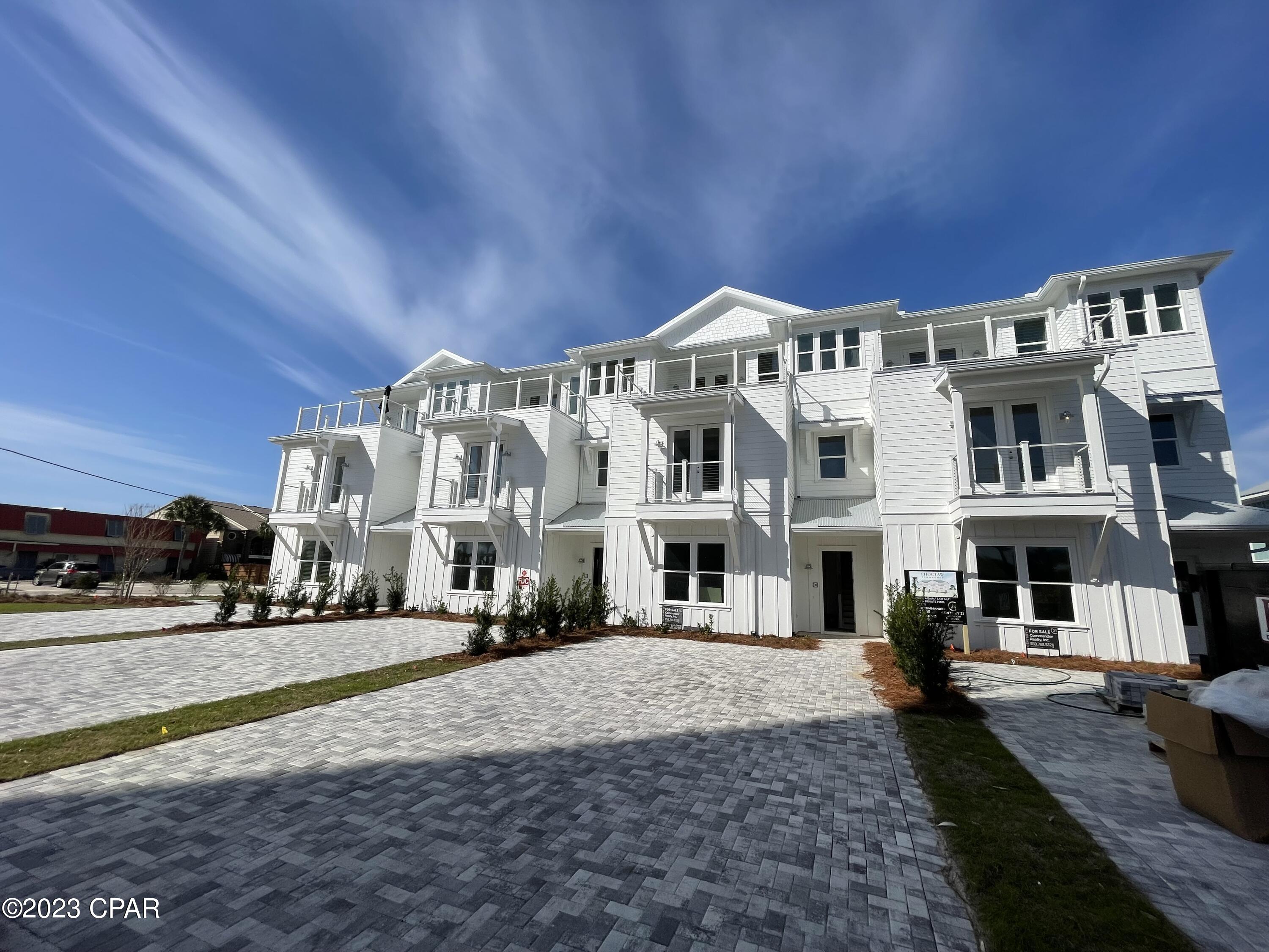 NEW CONSTRUCTION townhome with PRIVATE POOL! Located directly by beach access and VIEWS of Gulf from third level deck. This home will have a coastal feel once finished, with shiplap walls per plan, white cabinetry throughout, sparkling white quartz counters, and honey oak luxury vinyl plank. Entertain by your private pool with pavered patio, large open main living area, game room with large deck, wet bar with wine fridge on third level, and spacious bunk room. White cabinetry in kitchen with quartz countertops and stainless-steel appliances including refrigerator. Home will also have elevator for easy access to all levels. HOA fee is estimate and subject to change, homeowner will be responsible for maintenance of driveway, pool, etc.