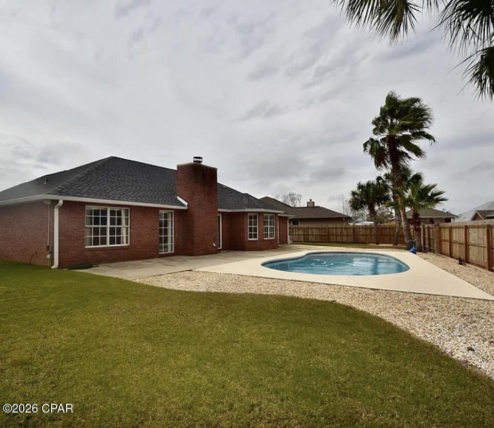 ~~Assumable VA 2.25% loan~~Beautiful all brick home with a pool, located in high desired, well established North Shore subdivision. 3BR/2BA is located on a quiet cul-de-sac. Split bedroom open floor plan has a large living area with a fireplace and formal dining room that invites lots of natural light throughout. The kitchen fully equipped with appliances, plenty of cabinets, pantry space and a breakfast area overlooking the pool. Large bedrooms, with Master bathroom hosting a Jet-style tub and walk-in tile shower. Large 4 car driveway leads to a 2-car garage with lots of room for storage. A spacious privacy fenced in back yard. Spend your summers lounging in the pool and entertaining your friends 
Home is located in the highly regarded Lynn Haven/Mosley school district, minutes from local shopping and entertainment allowing just a 15-minute drive to the beaches! All dimensions are approximate.