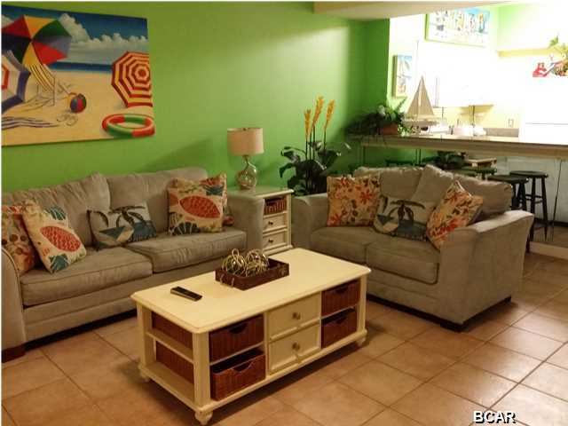This is a highly desired lower floor with dedicated parking place. Tiled throughout and brightly furnished. The sellers have added a door to the master bath as well as the bunk room. Please check out the Shores of Panama with the best location on the beach. Almost 500 feet of beachfront, 14,000 sq. ft. lagoon style pool, workout facilities,indoor heated pool, 2 day spas, tiki bar and grill. You can't beat the ammenities. You'll notice the difference the moment you drive in with our covered parking and entranceway. Please don't miss the opportunity to own at the best resort in PCB with the lowest prices
