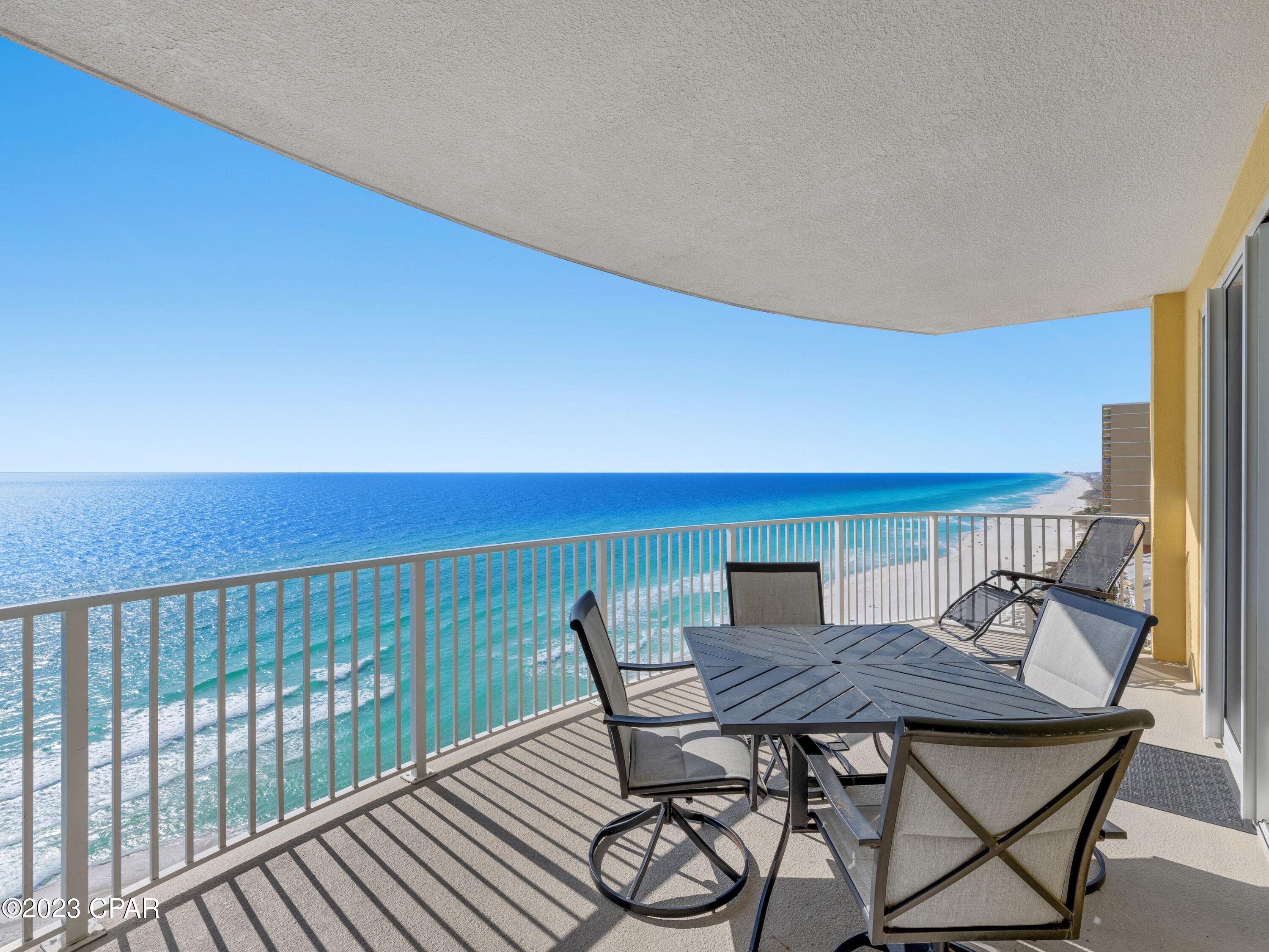 Presiding over the white sand and emerald waters at the sought-after west end of Panama City Beach, this 15th-floor condo has stunning gulf-front views. This prime end unit comes with a huge 272-sq.-ft. curved balcony providing ample private space for dining and relaxing. South- and west-facing windows deliver unobstructed views of the beach, coast and marine life including playful dolphins. The current owners have made many improvements to this well-maintained condo over the years including large tile flooring, replacement light fixtures, upgraded appliances, updated rugs and wall hangings, and new living room, bedroom and foyer furniture Most recent upgrades include a new dishwasher and water heater, replacement balcony furniture, new TV, new furniture in the foyer and guest bedroom as well as a new mattress in the master in 2022. 

The open floor plan includes a bright sitting area with sliding glass doors, a formal dining area for entertaining and a well-appointed kitchen with fresh white cabinets and stainless appliances. Granite countertops extend over the high-top breakfast bar, which easily seats three. Two delightful bedrooms are served by two modern bathrooms. The unit comes fully furnished and includes a pair of dedicated front-row beach valet chairs for 2023. 

Make the most of the excellent amenities offered at Emerald Isle including two pools (one heated), hot tub, sauna, fitness room, grills, gated security and a serene butterfly garden. There's a covered garage with ample parking and sky bridge access direct to the condo building. Four high-speed elevators serve this 21-story building, which has 201 luxury condos. Guests and renters will enjoy being just minutes from Mike's Oyster Bar, supermarkets, Pier Park attractions and 30A shopping and dining. Suitable as a full-time residence, second home or investment rental, it returns around 10 percent ROI with some owner use. A large owner's storage closet comes with the property.