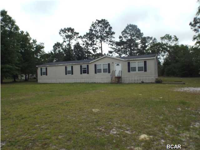 Four bedroom 2 bath manufactured home on an acre lot offered as is. The home boasts large living room, separate dining room and, fireplace. Enjoy a pleasurable quiet life in the country near Econfina Creek and Highway 20. Call for your personal tour today. All sizes are approximate please verify if important.