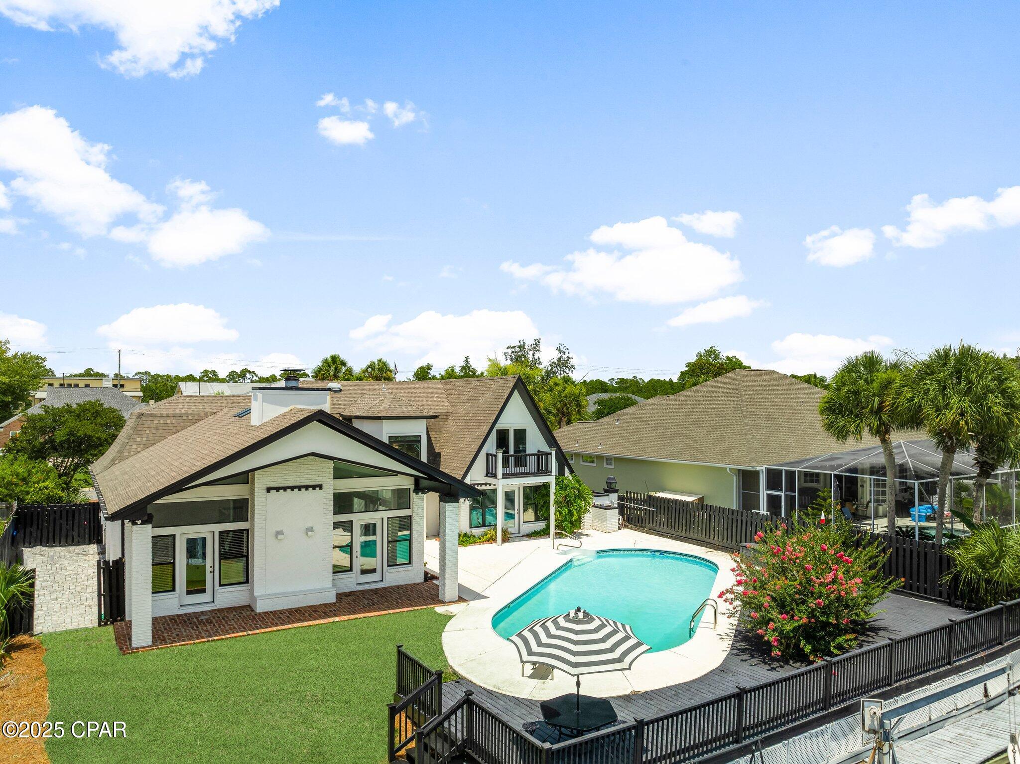 CURRENTLY UNDER CONTRACT, SELLER WILL CONSIDER BACKUP OFFERS
Stunning Waterfront home in Bay Point - A Boater's Dream!

This breathtaking 3189 sq ft waterfront home in the prestigious Bay Point community, offering 4 spacious bedrooms, 3 beautifully updated bathrooms, and a flexible bonus/game room that opens to a private balcony with panoramic water views.

Perfectly situated at a wide intersection of the canal with approximately 78 feet of water frontage, this home is ideal for large vessels and boating enthusiasts. Enjoy direct water access, a small boat lift, and a paver side yard perfect for additional storage.

Inside, you'll find a grand open-concept living space with vaulted ceilings, floor-to-ceiling custom windows, and a cozy fireplace, all designed to highlight the one-of-a-kind views and flood the home with natural light. The renovated kitchen is a chef's delight, featuring quartz countertops, stainless steel appliances, and a large breakfast bar perfect for entertaining.

The luxurious primary suite offers serene water views, a walk-in closet, and an updated ensuite bathroom with a double vanity, walk-in shower, and soaking tub. With two bedrooms upstairs and two downstairs, this layout provides comfort and privacy for the entire family.

Step outside to your private pool, expansive deck, and beautifully landscaped surroundings. Additional features include a U-shaped driveway, updated flooring throughout, and a large attic space for extra storage.

When you purchase in Bay Point you're not just purchasing a waterfront home. Bay Point is known for its pro golf course the Nicolas course, its newly renovated Marina, annual events such as Bill Fish and so much more. 

Whether you're seeking a peaceful getaway or an entertainer's paradise, this waterfront gem delivers coastal living at its finest.