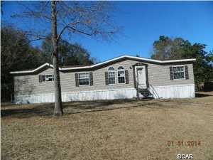 JUST REDUCED!! COUNTRY Living! Great home at an affordable price! Very Nice 3 bedroom 2 bath mobile home on a 1/2 acre lot. This home features kitchen with island bar. Nice size master bedroom. Master bath has a large garden tub with separate shower. Family room large enough to entertain and comes complete with a fireplace. Please come and see, you will not be disappointed. All info. taken from tax roll, please verify.