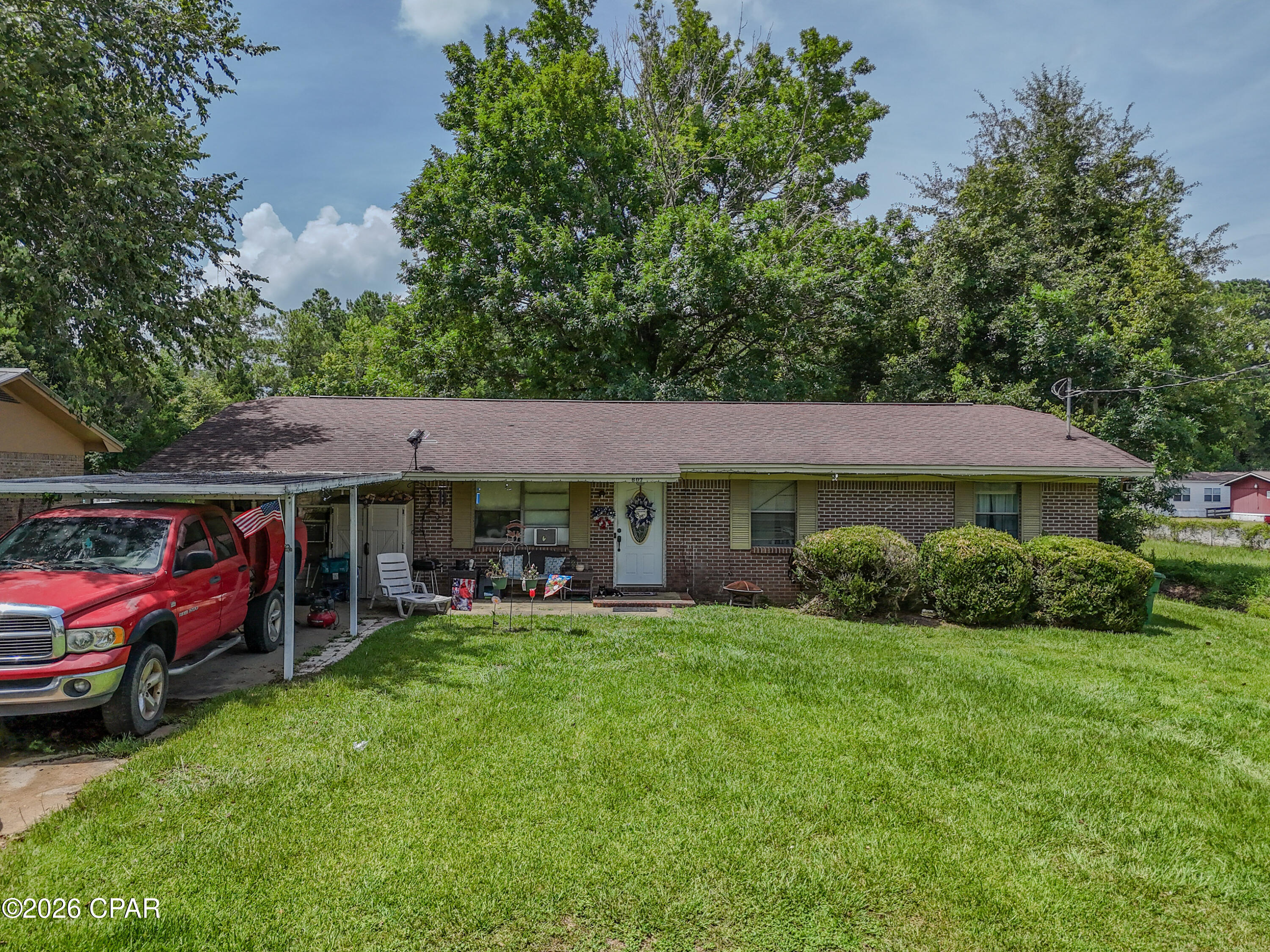 From the moment you arrive, you'll appreciate the pride of ownership and thoughtful updates this charming 4-bedroom, 2-bath brick home has to offer. Nestled on a quiet, paved street in Bonifay, this move-in-ready home combines comfortable living with everyday functionality.

Inside, you'll find a spacious floor plan featuring a private primary suite, a generous laundry room, pantry, and beautiful new wood flooring in the two rear bedrooms and bathroom. Natural light and a warm, inviting atmosphere make every space feel like home.

The backyard is designed for both relaxation and possibility. Enjoy mornings on the covered patio overlooking the fully fenced yard, complete with an oversized gates for easy access. Electrical service has already been run to the backyard, making it ideal for a future pool, workshop, or additional outdoor living space. A storage building and attached carport provide the extra convenience every homeowner appreciates.

With a roof replaced in 2014 and a location just minutes from schools, shopping, and local amenities, this home offers the perfect combination of comfort, practicality, and value. Whether you're searching for your first home, room to grow, or simply a place to enjoy small-town living, this is one you won't want to miss.