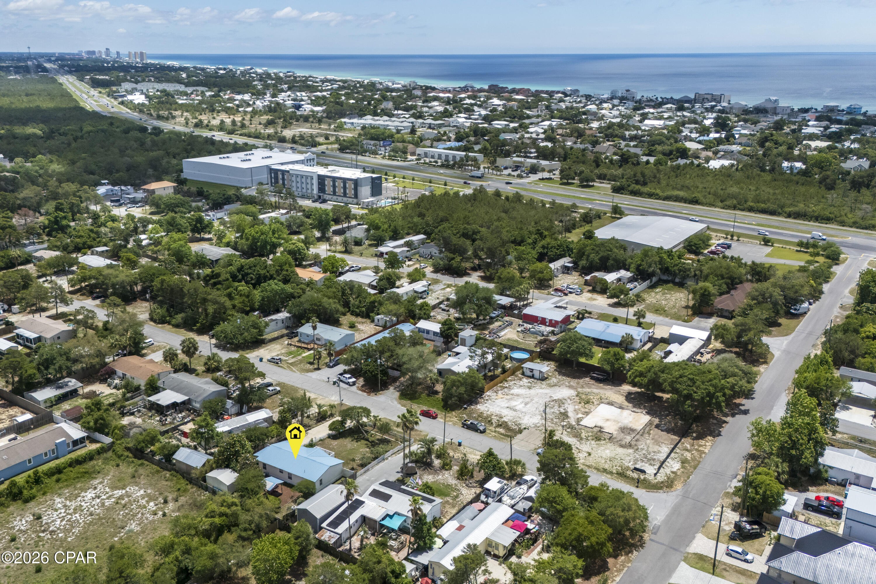 Tucked away on the growing west end of Panama City Beach, just minutes from the sugar-white sands of the Gulf and ideally positioned near 30A and Inlet Beach, this charming coastal cottage offers the perfect blend of lifestyle, location, and investment potential. Situated on a spacious .22-acre lot in a quiet, golf cart-friendly neighborhood, this property delivers a relaxed coastal vibe while keeping you close to the area's best dining, shopping, and entertainment.

Inside, the home features an open, functional layout filled with abundant natural light, creating the perfect canvas for a beautifully designed coastal retreat. Recent updates include new flooring, a new HVAC system, and a refreshed primary bathroom with double vanity and granite countertops, adding both comfort and value.

Step outside to an expansive deck ideal for entertaining, relaxing, and enjoying the Gulf breeze. A new concrete driveway adds convenience and curb appeal, while a nearby boat dock--less than 10 minutes away--enhances the coastal lifestyle.

With no HOA and no rental restrictions, this property offers exceptional flexibility and strong long-term rental potential. Whether you're looking for a primary residence, second home, or income-producing investment, the possibilities here are endless. There is also ample opportunity to expand, enhance, or reimagine the property to maximize its full potential.

Opportunities like this--just blocks from the Gulf and minutes to 30A--are becoming increasingly rare, especially at this price point. Don't miss your chance to secure a slice of the beach lifestyle with built-in upside.