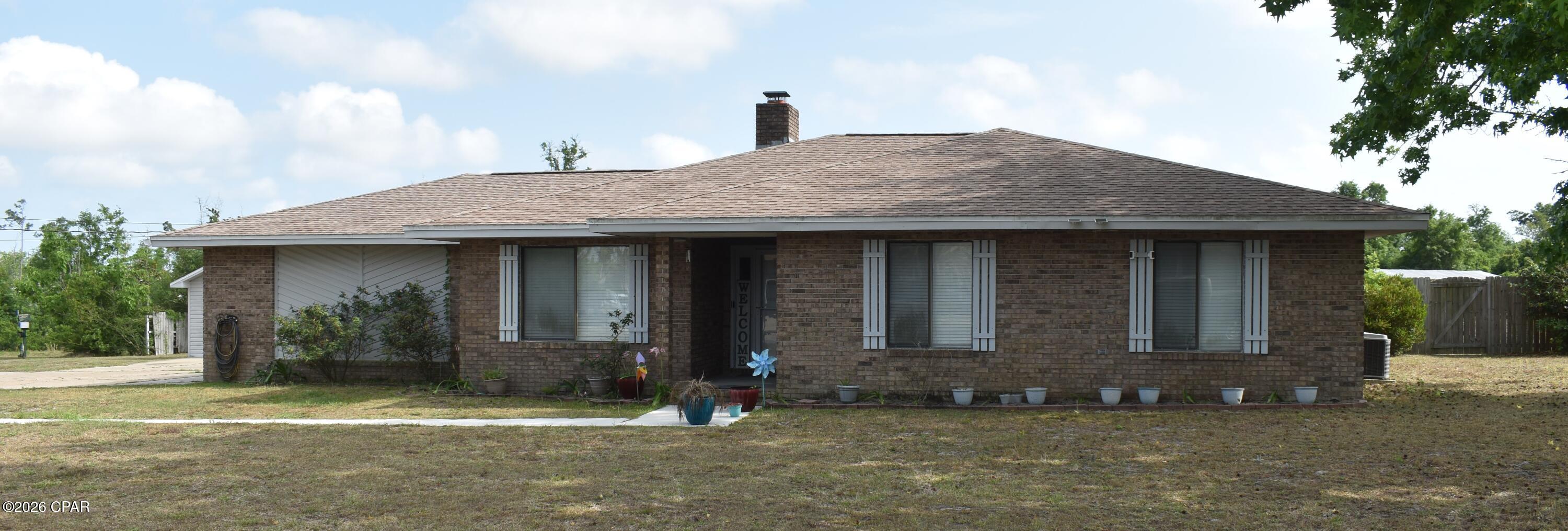 3622 Gaines St, Panama City, FL is a ranch style 3 bedroom 2 bath home on a large .6 acre lot with a privacy fenced back yard.  The house has low maintenance brick siding  and beautiful shade trees in the front yard to ease the cooling bill with the double paned windows.  When it comes to parking, you get a 2 car attached garage, enough concrete driveway with a turn around for more than a few cars, and another detached oversized one car garage.  Inside, you get large rooms including a living room with vaulted ceiling and woodstove insert in the brick fireplace.  Kitchen has great cabinets, new fridge and new stove.  The breakfast area with bay window has room for a large dining table and there is another dining room currently used as an extra bedroom.   In the master bedroom you have plenty of room for big furniture and his and hers closets.  The garden bathtub under the skylight is a place for tranquility.   If you want a large yard, plenty of room for vehicles, all on a short quiet street, just minutes from schools and shopping, this is your new home.