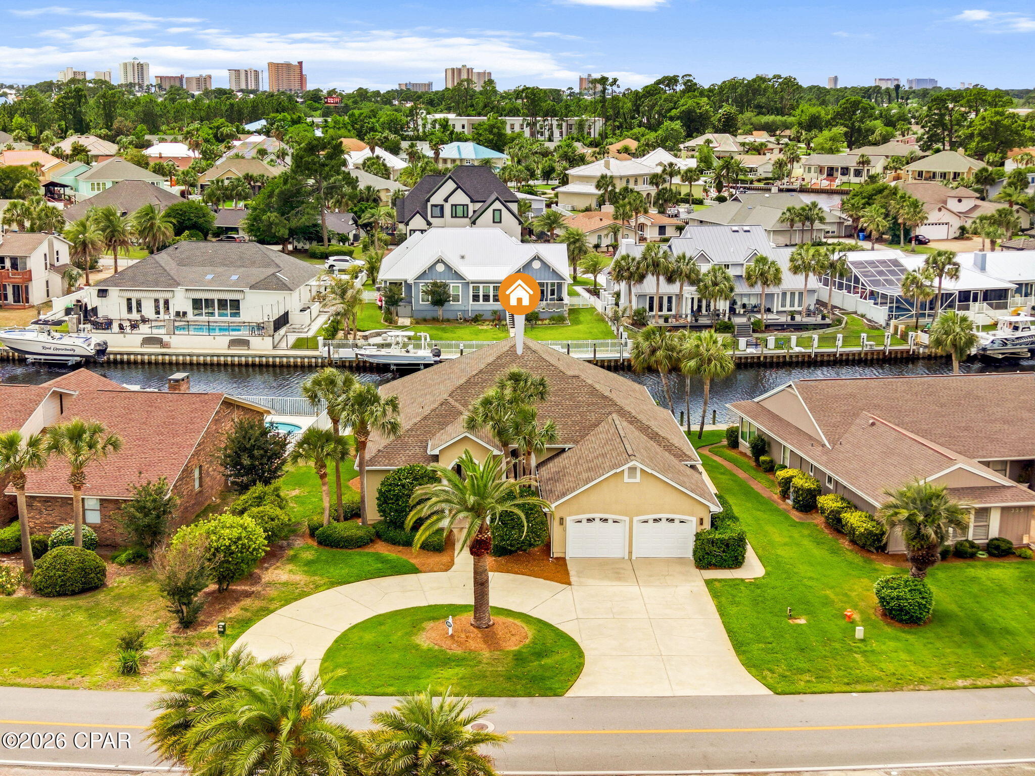 Located within the prestigious gated community of Bay Point, this beautifully updated waterfront residence offers the ultimate coastal lifestyle with 70 feet of deep-water frontage and direct access to St. Andrews Bay, the Gulf, and the Intracoastal Waterway. Designed for both comfort and entertaining, this single-story home combines elegant finishes with exceptional boating amenities.

With approximately 7 feet of canal depth, a private dock, and a 10,000-pound boat lift, boating enthusiasts will appreciate the quick and easy access to open water and the short ride to Shell Island. Step outside to your private swimming pool and tranquil waterfront setting, perfect for relaxing after a day on the water or entertaining family and friends.

Inside, soaring 12-foot ceilings in the foyer and 10-foot ceilings throughout create a bright and spacious atmosphere. A stunning mahogany entry door welcomes you into the open-concept living, kitchen, and dining areas, complemented by an additional family room for flexible living space. The light-filled living area features a fireplace with custom built-in bookcases, while French doors open seamlessly to the private pool area, blending indoor and outdoor living.

The gourmet kitchen is thoughtfully appointed with premium Sub-Zero and Wolf appliances, an induction cooktop, quartz countertops, and breakfast bar seating for four. Travertine and wood flooring run throughout the home, adding warmth and timeless elegance.

The spacious primary suite offers a private retreat with dual walk-in closets, dual vanities, a jetted soaking tub, and a large walk-in shower. Additional recent updates include a new water heater in 2025 and a 4-ton HVAC system installed in 2024.

Residents of Bay Point enjoy a secure gated environment with close proximity to Bay Point Golf Club, Bar 72, marinas, dining, and the white sand beaches of Panama City Beach. This is a rare opportunity to own a true boater's paradise in one of the area's most sought-after waterfront communities.