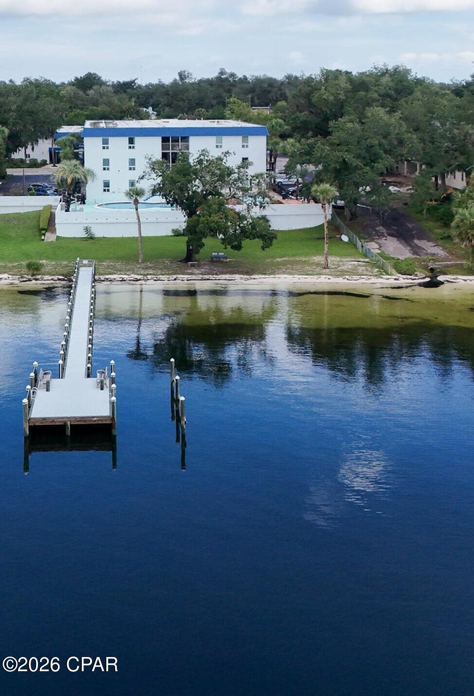 Ground-floor 2BR/2BA Bay Club condo in Bunkers Cove with beautiful St. Andrews Bay views. Bright open living space with easy access to the in-ground pool and bayfront area.  Community amenities include pool, private dock, and beach area for fishing or kayaking. Just minutes from downtown Panama City shopping and dining. Rent includes: water, sewer, trash, basic cable, bay access, in-ground community pool, and one dedicated parking space directly outside the unit.No Smoking. Some pets will be considered. **Interior Professional Photographs Coming Soon**