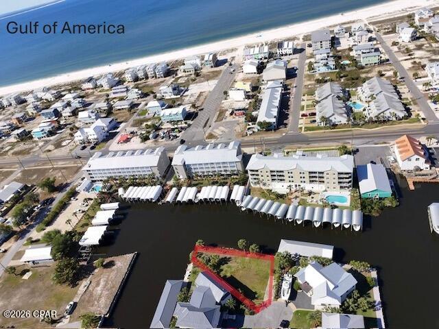Imagine owning a rare canal front corner lot in picturesque Mexico Beach, FL — a private cul-de-sac location with immediate water access, room for more than one boathouse, and all the conveniences of beachside living within a half mile. This is a unique investment opportunity for boat owners, builders, and vacation rental investors who want prime Gulf Coast access without the premium price of direct gulf front. A corner lot on the canal provides expanded water frontage (approximately 135+/- feet on one side and 36+/- feet on the other), giving you flexibility for dock placement, additional boathouse structures, and multiple boat slips. A fisherman's delight! Located on the north side of Hwy 98 in a somewhat private section of Mexico Beach, this lot sits at the end of a quiet cul-de-sac — ideal for privacy while remaining close to community amenities. Enjoy the convenience of a quick golf cart or bike ride to pristine beaches—perfect for vacationers, renters, and owners who want easy access to sun and surf. All essential services, dining, and shopping are within approximately a half mile, making daily life and rental stays effortless and attractive to visitors. Miles of beach to explore and sunsets to enjoy
