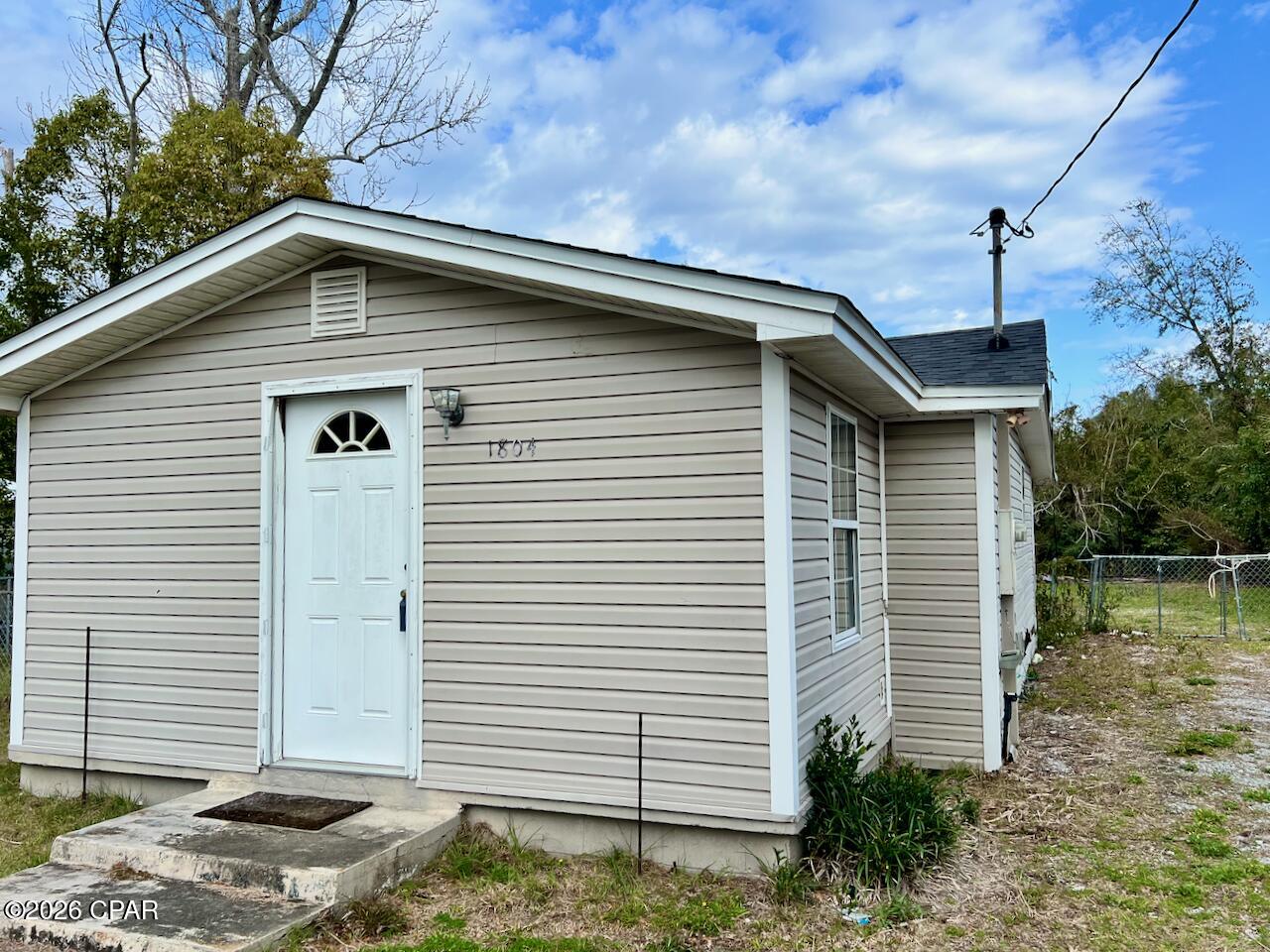**CURRENTLY UNDER CONTRACT, SELLER WILLING TO CONSIDER BACK UP OFFERS** This home at 1804 Hickory Ave in Panama City, Florida, is located in the historic St. Andrews district with the beautiful St. Andrews Bay a short drive away. This is a GREAT INVESTMENT OPPORTUNITY or to live in while you work on making improvements. 
This 2-bedroom, 1-bath home is being sold AS-IS, with strong potential for renovation with several big-ticket components already updated, including the roof, double-pane windows, new back door, electrical, HVAC system, water heater, appliances, and kitchen and bath fixtures. The property will require some exterior improvements and general cosmetic finishing inside. The spacious lot includes a large backyard area with remaining debris from prior outbuildings lost during Hurricane Michael; buyer to assume responsibility for cleanup. Available for Cash or Conventional financing, with potential options for an FHA renovation loan. Please inquire for additional info on loan programs. Schedule your showing today, and see how you can give this house the TLC it deserves! All measurements approximate; buyer to verify if important.
