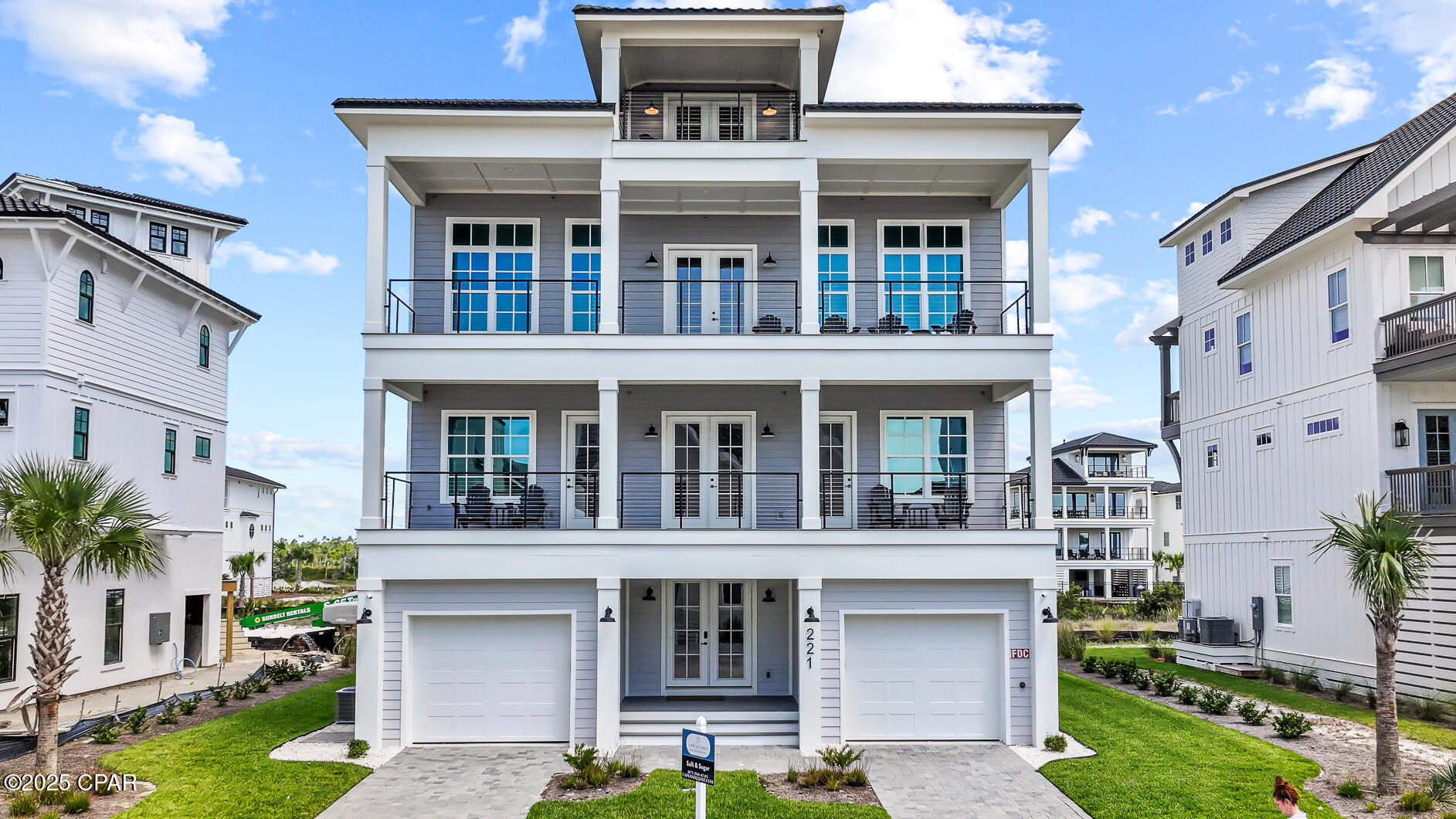 STRIKING 1ST TIER COASTAL RETREAT! Perfectly positioned in the heart of the gated Sugar Sands community, this new 5-bedroom, 5.5-bath home delivers resort-style amenities, sweeping Gulf views & thoughtfully designed spaces ideal for family gatherings or exceptional rental income potential. The ground level welcomes you with a covered entrance, inviting foyer, dual garages perfect for vehicles or golf carts, outdoor shower, half bath & elevator access to all levels. The heart of the home awaits on the second floor with an open-concept living area featuring expansive seating, built-in storage, & broad decks that extend your living space outdoors. Panoramic views of the coastline set the backdrop for entertaining, while the chef's kitchen boasts top-of-the-line stainless appliances, a 4-burner gas range with griddle, oversized island with seating, butler's pantry, & coffee bar. A full dining area & breakfast bar offer plenty of room for casual meals or elegant dinners. The layout is designed for privacy & flexibility. On the first floor, two luxurious king suites feature private deck access & spa-style baths with double vanities & zero-entry showers. Two additional queen bedrooms with private balconies & a shared bath provide comfortable accommodations for guests. The bunk room keeps family close by while giving kids their own retreat. The loft lounge on the top floor is the ultimate sunset perch, overlooking miles of uncrowded beaches protected by nearby Tyndall AFB—ensuring endless privacy & unspoiled Gulf views. The spacious yard includes irrigation, gravel patio, & room to add a pool, making outdoor entertaining easy. Community amenities feature a resort-style pool, fitness center, clubhouse, & private golf cart beach access just steps away. Offered fully furnished & turnkey, this home is ready for immediate enjoyment or strong rental performance. Call today for your private tour & LIVE THE BEACH LIFE!