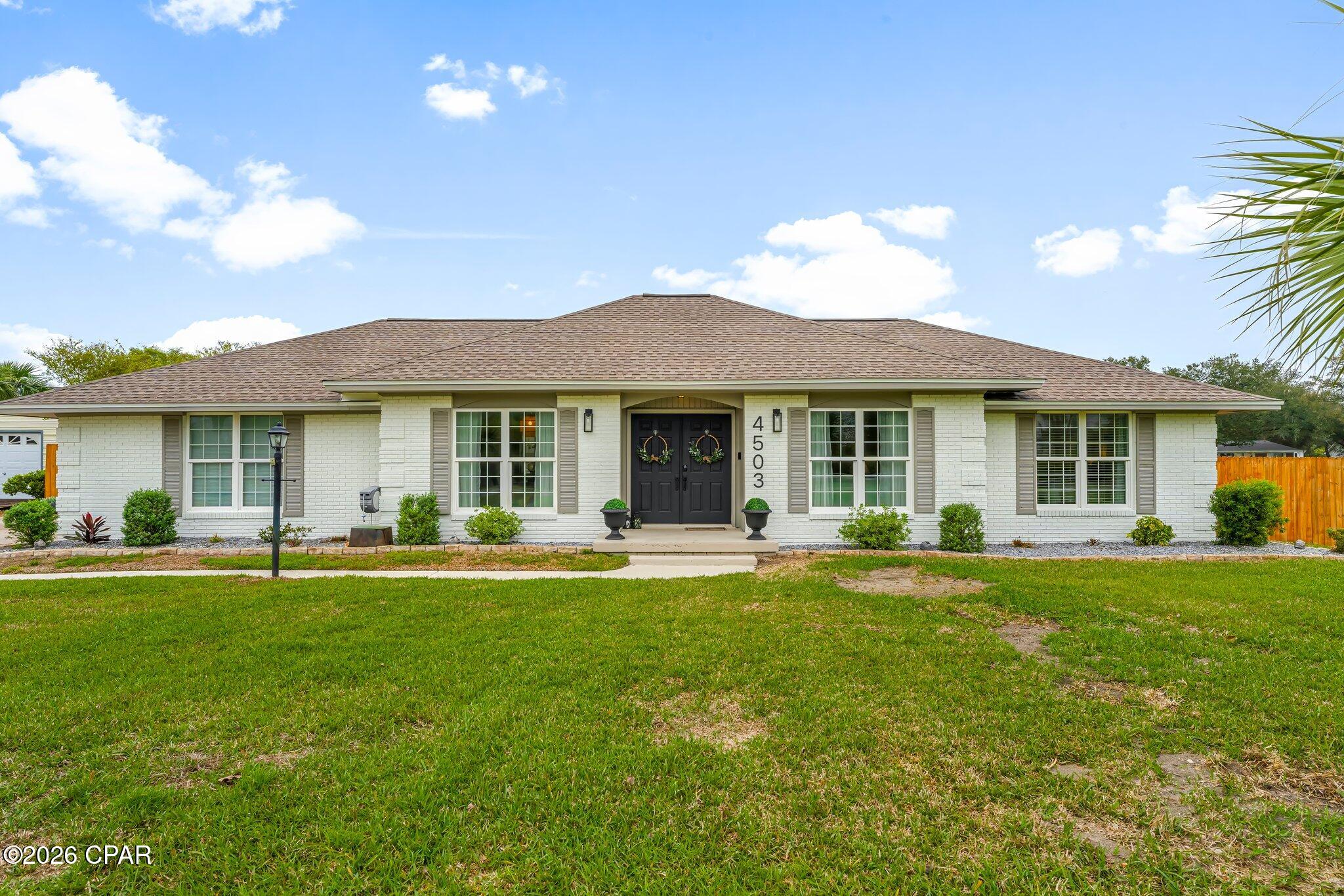 Welcome to waterfront living in the heart of Lynn Haven. Ideally situated on North Shore Road, this beautifully updated canal-front home features 3 bedrooms, 2 bathrooms, and 2,120 square feet, along with 125 feet of waterfront, a private pool, and direct water access. Offering the perfect blend of comfort, style, and coastal lifestyle.

From the moment you enter, you're greeted by a grand foyer that sets the tone for the home. Just off the entry are two spacious and versatile rooms, ideal for a formal dining room and a refined sitting area or home office, perfect for both everyday living and entertaining.

The kitchen is thoughtfully designed for a true home chef, featuring ample workspace, abundant cabinetry, and all new appliances (2024). The layout flows seamlessly into the main living areas, creating an inviting space to gather. Just beyond, the oversized utility room offers exceptional storage and functionality, an incredibly rare and practical feature.

The primary suite offers a beautifully updated bathroom with modern finishes, featuring a step-in shower with floor-to-ceiling tile for a clean, elevated look. The guest bathroom is equally well-appointed with a tub/shower combo and striking mosaic tile carried floor to ceiling.

Step outside to your private backyard retreat where a sparkling pool is complemented by lush, mature landscaping and a modern pergola designed to accommodate both an outdoor living area and dining space. With 125 feet of canal frontage, this property offers direct water access, making it ideal for boating, kayaking, or simply enjoying the coastal lifestyle.

Major system updates provide peace of mind, including a new HVAC system and ductwork (2025), new pool pump, sand filter, and liner (2025), water softener (2023), roof (2019), and seawall (2013).

Located in the highly desirable Lynn Haven area, this home offers convenient access to top-rated schools, parks, shopping, and dining, while remaining just a short drive to Panama City, St. Andrews, and the white sandy beaches of Panama City Beach.