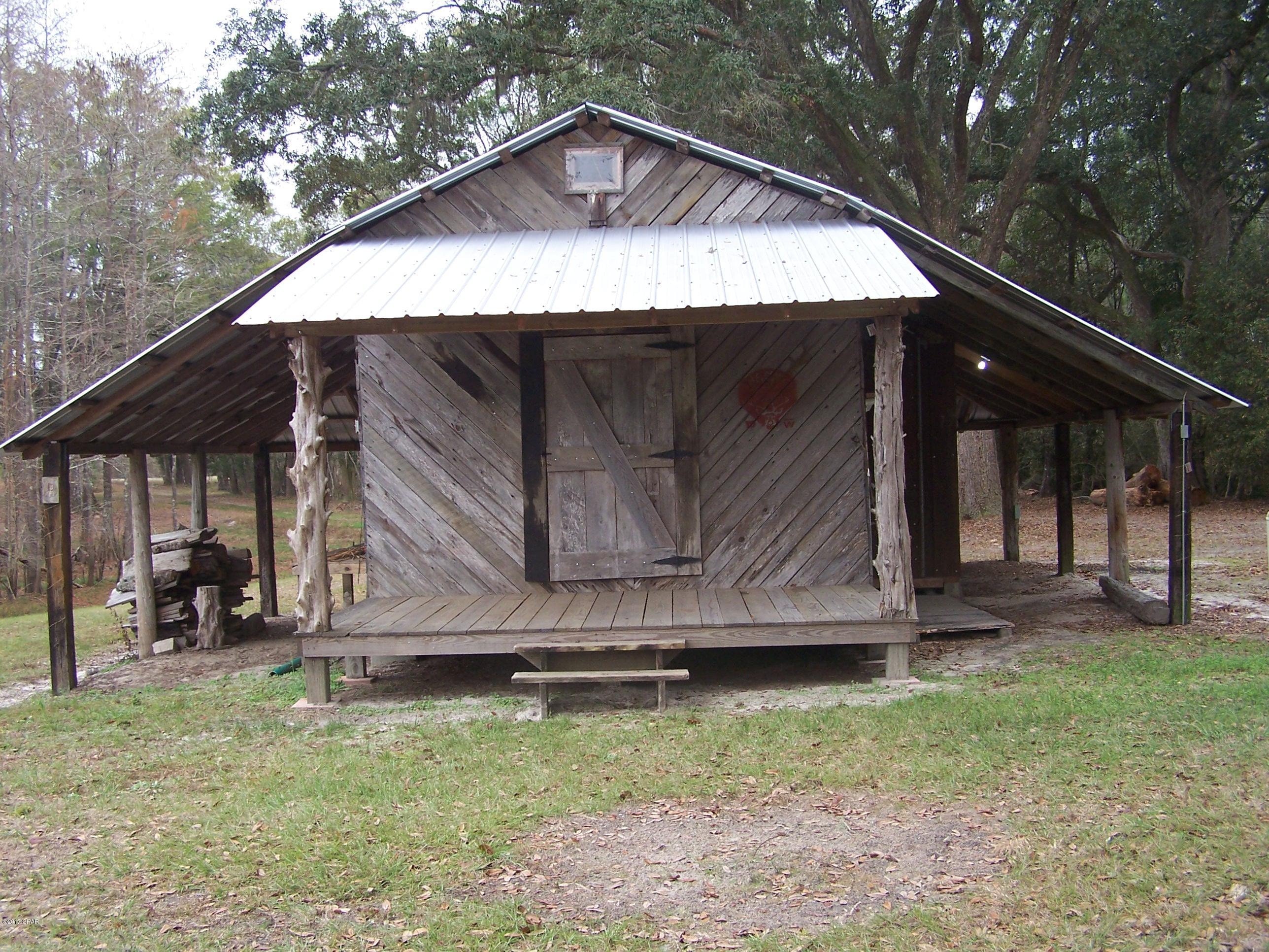 124acs on the beautiful Reedy Creek and a +3ac Pond! Looking for that GREAT Weekend get-a-way, or maybe a Hunting & Fishing Retreat, or what about a beautiful Homesite?? This place meets all your Country Property needs. Come and follow the winding drive through the Grand Live Oak Hammock to a rustic Cabin complete with Power & Water. Approx 50 Cropland Acres, 20 Acres in Pines and the remaining in Hardwoods and Creek Frontage which covers the entire eastern property line. Call today for your Personal Tour!