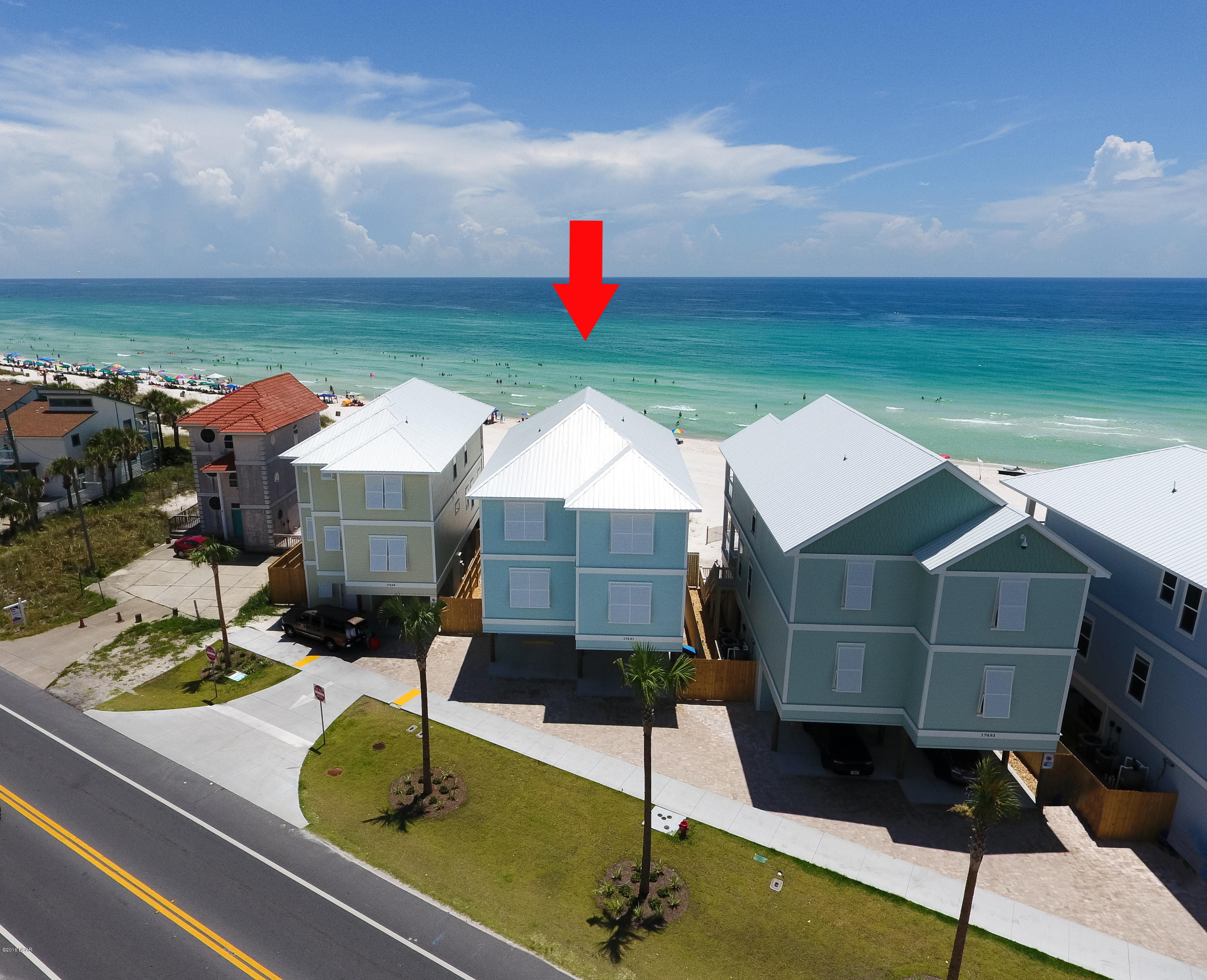 NEW CONSTRUCTION Gulf-front home on the west end of Panama City Beach (video under photos tab). Built to the highest standards and codes this 6 bedroom, 6 full baths and 2 half baths will make a wonderful family retreat, or great investment property.  This home has it all including a 16' X 8' beachfront pool surrounded by glass screening for full views of the beach. Outdoor space sports a pool deck with built-in grilling area, covered cabana area which serves both the sun lovers and those wanting to chill in the shade. You will find a pool bath in the ground floor foyer along with a nice owners closet.  Second level is the main living space with open concept living incorporating the living room, dining room and spacious kitchen with a 11' bar. In addition to the second powder room there are 2 guest bedrooms and baths on the main level.  Moving up stairs to the third level you will find 2 more guest suites and essentially 2 master suites, both Gulf-front and each opening onto the Gulf-front porch.  Interiors are neutrals with classic whites and soft grey tones. All flooring is simulated wood-look tiles.  Even the stairwell is tiled wainscoting. Home is built to last with 150 MPH impact windows and doors, metal roof, and concrete board siding. Amazing property! Home fully furnished and rental ready.