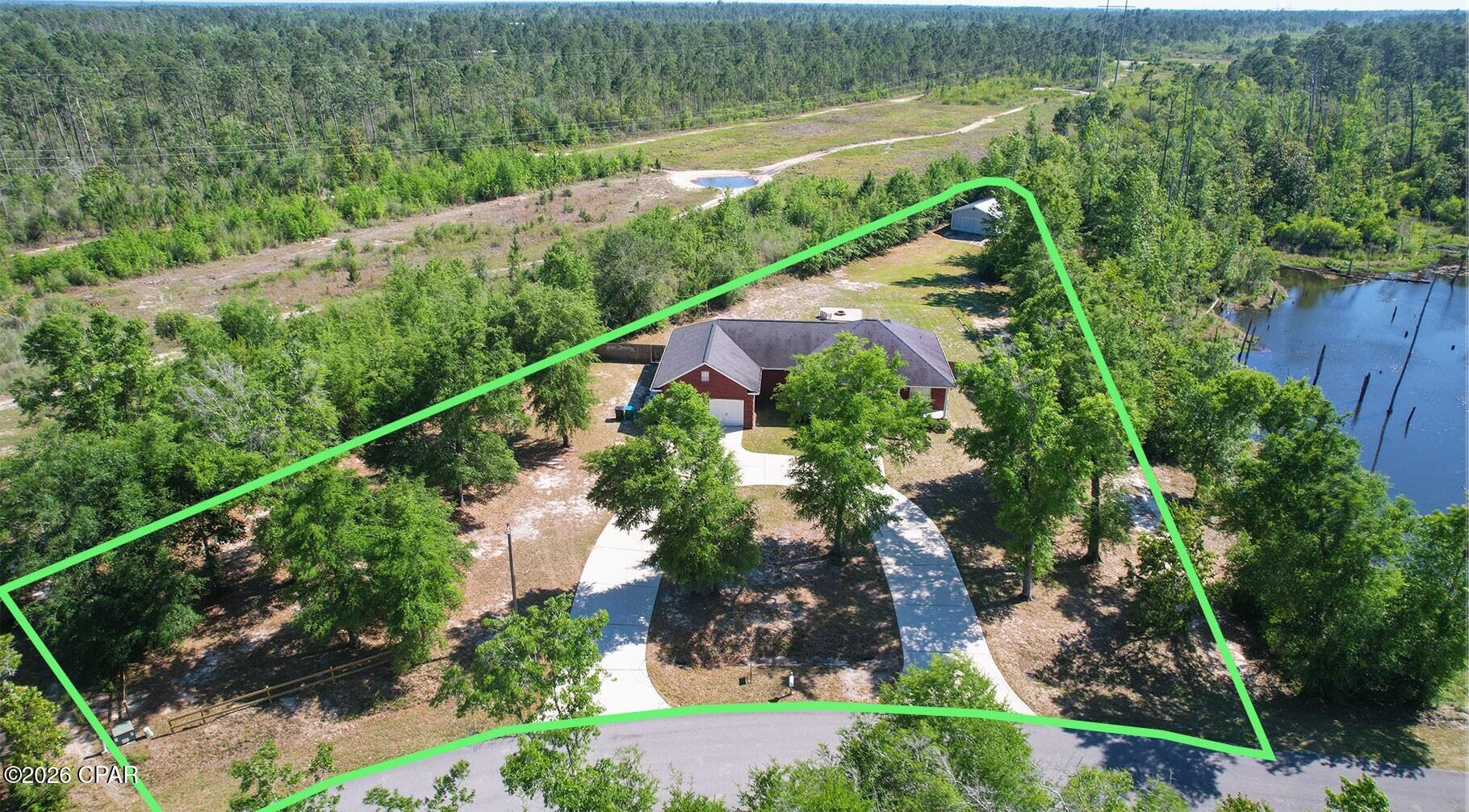 Situated on 1.7 acres, this well-maintained all-brick home offers the perfect combination of comfort, functionality, and space. Featuring 3 bedrooms and 2 bathrooms, this property is ideal for those seeking peaceful country living with modern conveniences. Outside, you'll find a full RV hookup with 50-amp service, making it perfect for travelers or guests. A spacious workshop in the backyard is wired with 220 power, ideal for hobbies, storage, or equipment needs. The home is also equipped with a powerful 22,000-watt generator, providing added security and peace of mind during any season. With plenty of room to enjoy the outdoors, this versatile property is ready for work, recreation, and everyday living.