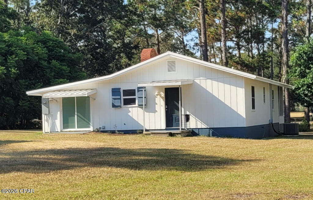 Located on the 8th Hole of Dogwood Lakes Estates and Golf Club, Holmes County, Florida.  The home is move in ready, the roof is metal and it has a recently installed new septic tank system.
 Recent site work includes removal of 13 pine trees with roots and the installation of underground electric.  There is a new central heating and air conditioning system installed 2/2222 and a new tankless water heater was recently installed.  The house has recently been painted inside and out.  
The kitchen cabinets are recently installed and have granite counter tops large enough to dine on.  The bathroom has a new cabinet with granite countertop.  The living area has a huge new JELD-WEN double patio door with side lights.  The entire patio door unit comes with blinds inside the double glass doors that open onto a 24' x 8' covered screened porch. The porch has a panoramic view of the golf course. The living room has a wood burning fireplace for cozy nights.   There is a golf cart garage.   The house has a bonus room for whatever you need it for. This house is low maintenance and conveniently located within driving distance to the beaches, fishing, hunting, shopping, golf and more.  If you need more room for your toys, the owner has an additional lot for sale across the street.  
The Dogwood Lakes Golf Club House has a club house that offers food and spirits!
NO HOA 
AND 
NO MEMBERSHIP FEES FOR GOLF CLUB
