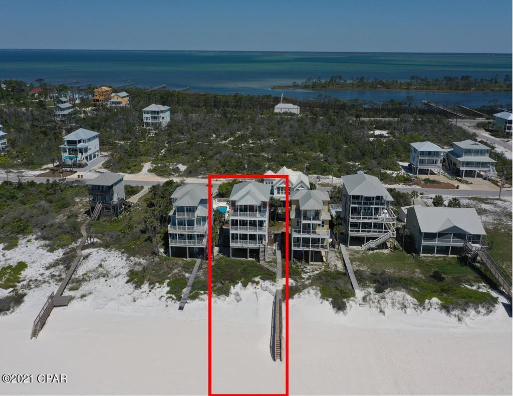 Custom gulf front home on North Cape San Blas overlooking one of the nicest beaches around. This home was built to be a great investment/second home and it's been just that for years and has a proven rental track record. It's loaded with custom features and amenities throughout the 6BR's and 5.5BA's and comfortably sleeps 14. Lots of good deck space overlooking the beach and views are enjoyed throughout the home. The elevator goes to all floors and this home is part of a 4 home HOA that share a community pool. Being sold fully furnished and equipped. Home is rented solid through September and can only be shown during turns on Saturdays. Buyer must honor the rental agreement with Cape and Coast. Interior of the home has been newly repainted since these interior pictures were taken. One of the owners is a licensed Realtor.GRI-$160K