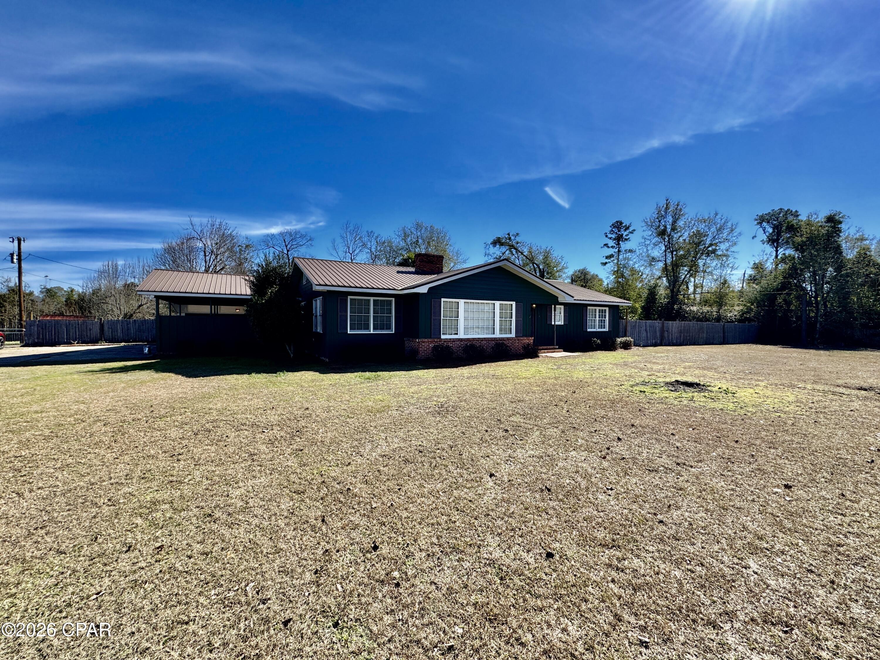 Renovated, spacious, and full of charm—this exceptional 4-bedroom, 4-bath home offers 3,092 square feet of comfortable living on 2.2 beautiful acres in Blountstown, Florida. Enjoy the best of small-town living with room to breathe, great neighbors, and no HOA. This move-in-ready home features a durable metal roof, original hardwood floors, and a thoughtfully updated interior that blends character with modern convenience. The large yard is partially fenced, offering endless possibilities for outdoor living, pets, or gardening. A generous back porch provides the perfect space for entertaining or relaxing while enjoying the peaceful surroundings. Plenty of land, privacy, and space inside and out. Conveniently located—not far from the Gulf beaches and within easy reach of Tallahassee. A rare opportunity to own a large, renovated home with acreage and a true small-town feel.