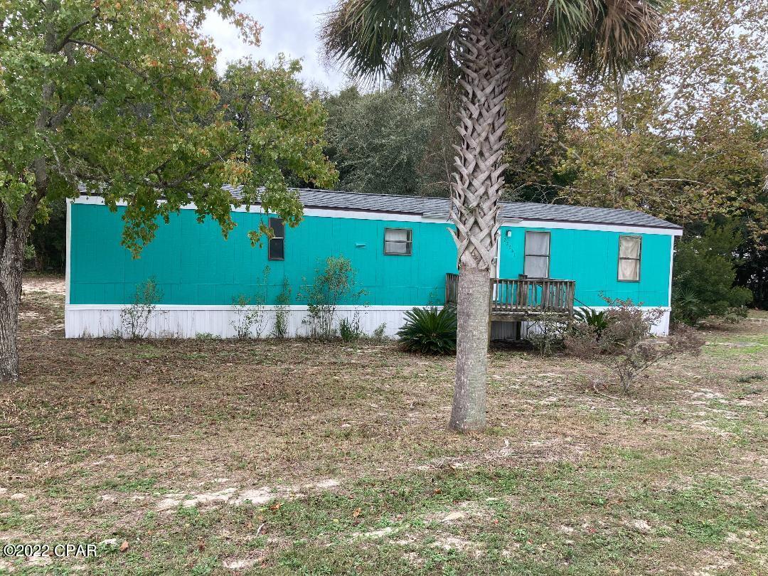 CURRENTLY UNDER CONTRACT, SELLER WILL CONSIDER BACKUP OFFERS' -Needs paint and flooring - otherwise good to go. Large, corner lot, Golf cart community, Prestigious west end of PCB UNDER $200K!!!