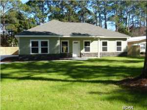 Seller will pay $2,500 toward Buyers closing costs!!! Here is your opportunity to be in your brand new 3 bedroom 2 bath single story home situated on a 75' x 190' lot located in the heart of Panama City Beach. You are minutes away from the Navy base, shopping, entertainment and the beach in time for the holidays. This home features over 1,500 square feet of heated and cooled living space. All of the bedrooms have plush upgraded carpet, all of the other areas have porcelain tile. The master bedroom features a nice oversized walk-in closet. The master bath has double vanities and a large walk in shower. All of the kitchen appliances, including the refrigerator are stainless steel and the countertops are a beautiful warm granite. All of the exterior walls were constructed with 2x6's and