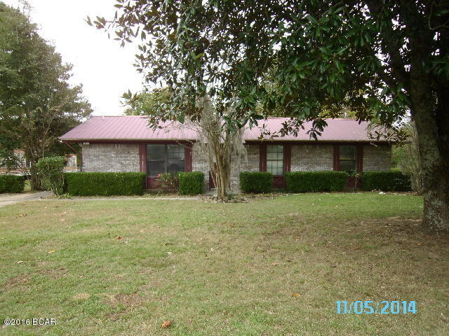 * PRICE REDUCED * This is a neat brick house just outside of town on a large lot with plenty of room for a garden and pets & animals. There are 2 metal storage buildings and an old single wide trailer considered personal property that is used for storage. The house has a nice floor plan with good room flow. The kitchen overlooks the back yard and there is a nice size utility room with room for your freezer and more.