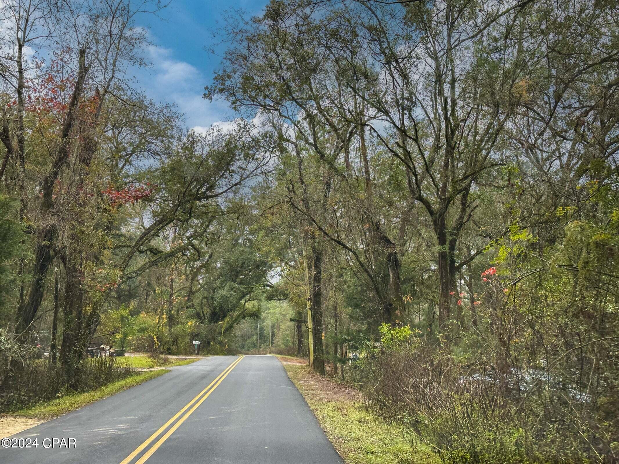 Dream Location for Country Living or Hunters Paradise either way you won't want to miss this opportunity! Beautiful homesite, Paved road close to I-10 .This Beautiful 13.26+/- Acres of prime land has so much to offer, Power is available. Creek running through portion of this parcel. Bring your build plans, hunting gear, Horses and ATVS LOCATION LOCATION!!!! This Property has Easy Access to Panama City Beaches I-10, Hwy 79, Hwy 81, and Hwy 90DEED RESTRICTIONS. SEE DOCUMENTS