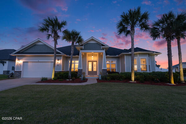 Luxurious coastal living awaits in this newly listed 2500 sq. ft. 4 bedroom 3 bath pool home in Dolphin Bay! Savor the sunrise views over the intercoastal waterway and the bridge's evening spectacle as it lights up with color. This craftsman style home, built in 2017, features a formal dining room, breakfast nook, and an inviting kitchen with an island perfect for entertaining. The large plantation style windows provide ample natural light and gorgeous views of the intercoastal waterway. Luxury finishes include porcelain wood tile flooring 12-foot ceilings, crown molding, and granite countertops throughout the home with beautiful tray ceilings in the living room, dining room, and master bedroom. Amenities include a marina with available boat slips, tennis/pickleball, and nature trails.  Truly a must see! Roof 2017, HVAC 2025, water heater 2017, new coated garage flooring in 2023, new kitchen appliances in 2024, and all new grass and landscaping. Furniture is negotiable. 
Age, Sq ft. Dimensions  approximate and must be verified by buyer.