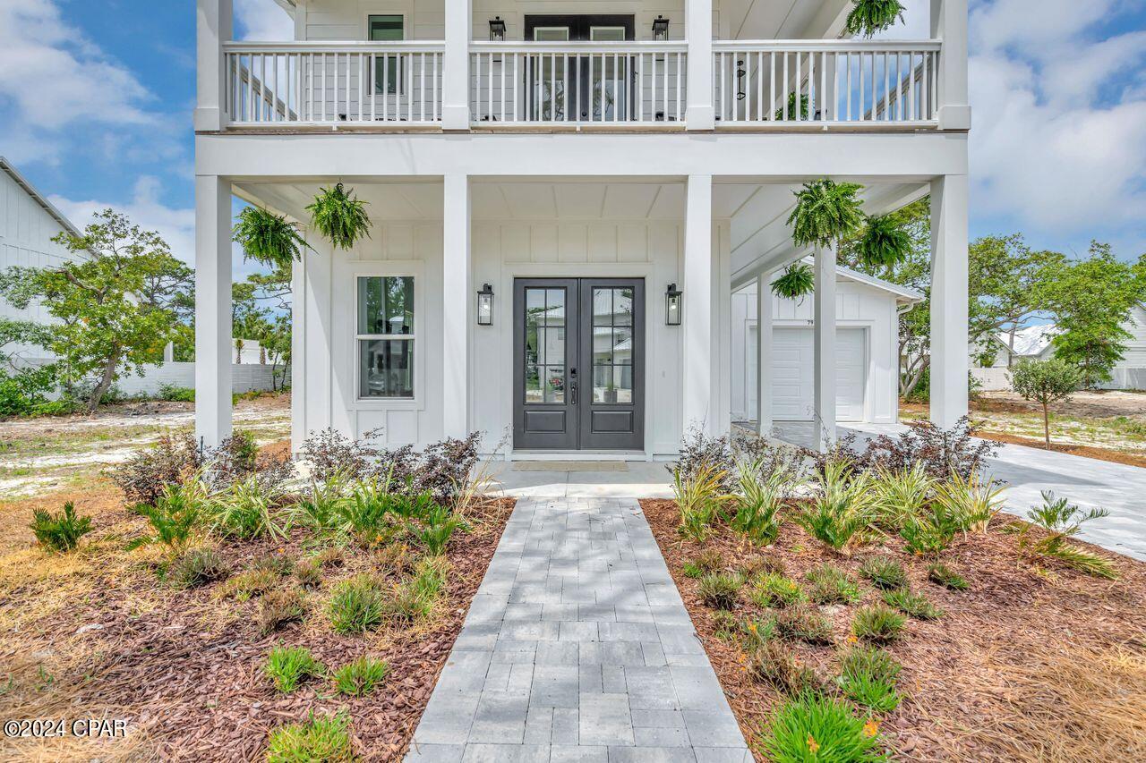 Price Reduced, Beautiful new construction home, and stunning  new coastal furniture, Entirely furnished!   All  windows are High Impact Windows.  This includes new washer and dryer as well. Beautiful bedding and bathroom linens included. Less than four blocks from the beach! Five bedrooms all come with a private bathroom and an
extra one-half bath on the main level. Open floor plan living area and kitchen on the main floor with ten-foot ceilings. The living
area opens to a covered porch to enjoy the outdoors. Primary suite on the main level for convenience. Also, a mud room with a
door to the outside for beach traffic.  Fully equipped kitchen with gas stove. Upstairs you will find four  additional bedrooms plus
an office/bunk room all with ten-foot ceilings. French doors lead to wrap wrap-around balcony to enjoy the gulf breezes.
Oversized garage perfect for extra storage for paddle boards and water toys or even a golf cart. New, freshly landscaped that adds a special touch.