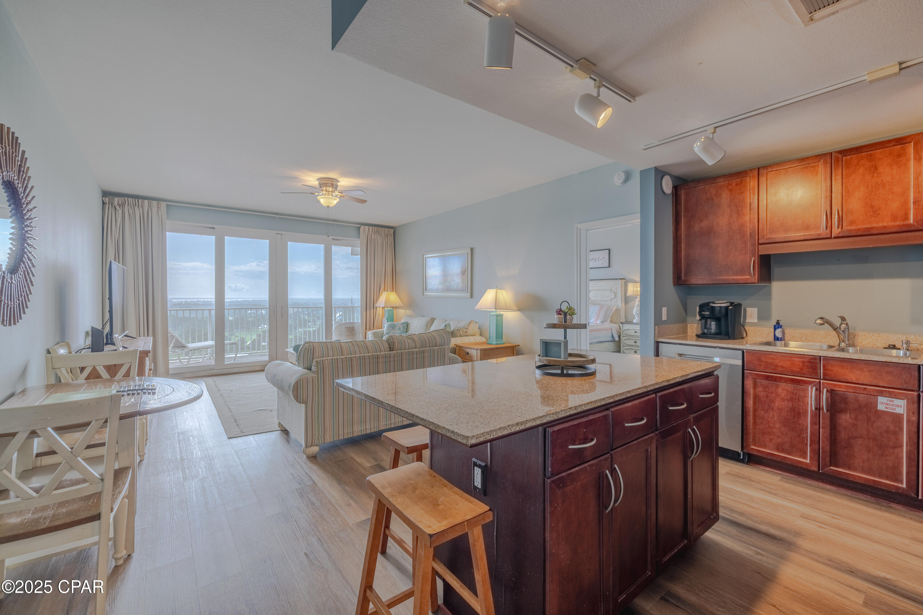 Beautifully Updated 3-Bedroom Gulf-View Condo at Laketown Wharf. Discover the perfect blend of value, space, and luxury in this beautifully decorated 3-bedroom, 2-bathroom condo at Laketown Wharf Resort in Panama City Beach. Offering over 1,260 square feet of coastal living, this 18th-floor unit comfortably accommodates up to 8 guests and boasts one of the largest floorplans on the beach. Step onto the oversized private balcony overlooking the lake and unwind as the nightly light and fountain show dances below—an unforgettable experience right from your own condo. Interior Highlights include: The owner's suite features a king-sized bed, scenic views, balcony access, and a spa-inspired ensuite with double vanities, a large soaking tub, and separate walk-in shower. The second bedroom offers a queen-sized bed, ample closet space, and easy access to the hall bathroom. A third bedroom includes bunk beds tucked into a private nook—perfect for kids or guests. The kitchen is fully stocked and ready for your convenience, featuring granite countertops, a breakfast bar, and an adjacent dining area for easy entertaining.
Laketown Wharf Resort Amenities include:
Private beach access just across the street—mere steps to the sand and famous cocktails at Pineapple Willy's. Five pools, including a rooftop pool, zero-entry pool, shaded pool, island pool, and a splash zone for kids, Two hot tubs and expansive sundecks, 52,000 sq ft boardwalk with nightly light & fountain shows, Putting green, outdoor gazebos, and daily pickleball action,    Gulf-view fitness center - a 2-story gym with cardio, weights, sauna & steam room. Onsite restaurants & bars, retail shops, and Laketown Market for beach essentials. Brand new entertainment venue (opened Feb 2025) at the Convention Center - with bowling, video games, food, and massive screens to catch all your favorite sports! Covered parking garage, 24/7 security, and multiple high-speed elevators. Whether you're searching for a vacation getaway, investment property, or a primary residence, this turn-key condo offers it all—space, comfort, resort amenities, and unbeatable location in the heart of Panama City Beach. Ready to see this incredible unit for yourself? Call today to schedule your private showing!
