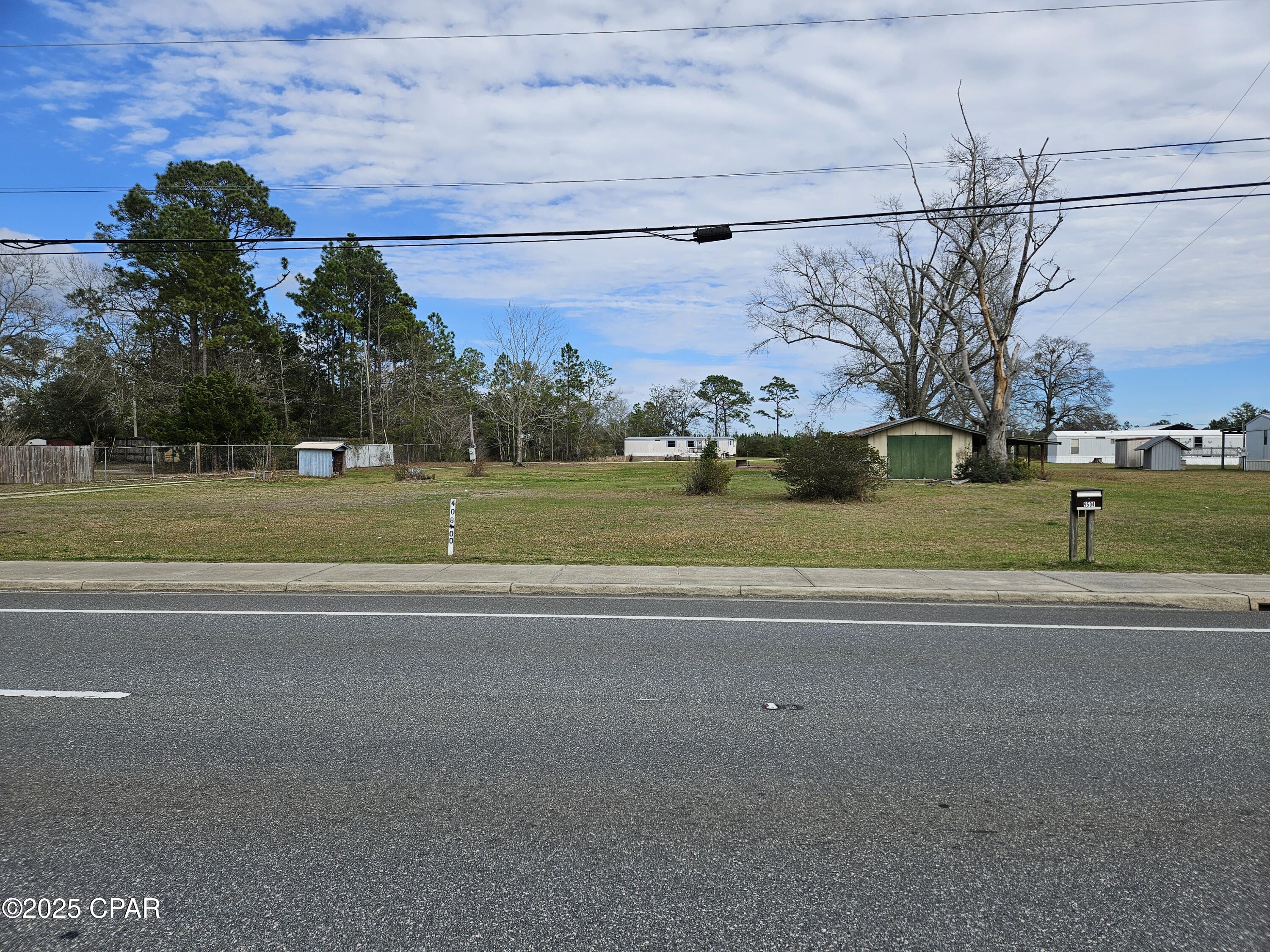 This prime location is already zoned commercial and is just north of Margaritaville on the east side. It consists of 2 properties that total approximately 3.222 (+/-) acres and is flat and mostly all cleared. It has approximately 370 frontage on Hwy 79, and on the south end there is a median cut for easy access for those traveling south. The 9430 Hwy 79 property is zoned C-2 while the 9504 Hwy 79 property is zoned Village Commercial. From the traffic light entrance to Latitudes by Margaritaville, a popular senior living community that has already closed out 1,000 new homes, and it is visible from the subject property. Current Latitudes residents have to drive all the way to the beach to enjoy dining, shopping, entertainment or other business. Whatever is on the subject property would be so convenient for local residents as well as drivers passing by going to and from the beach, which is about 7 miles to the south. Meanwhile, last week Publix announced it will build a new Publix Super Market at Watersound West Bay Center with additional leasable commercial space which is less than a half-mile away from this property. Also, the undeveloped acreage behind the subjects parcels is owned by St. Joe Timberland Company. (See more data in 'Documents') Information on size taken from Bay County records. Buyers are encouraged to get a survey.