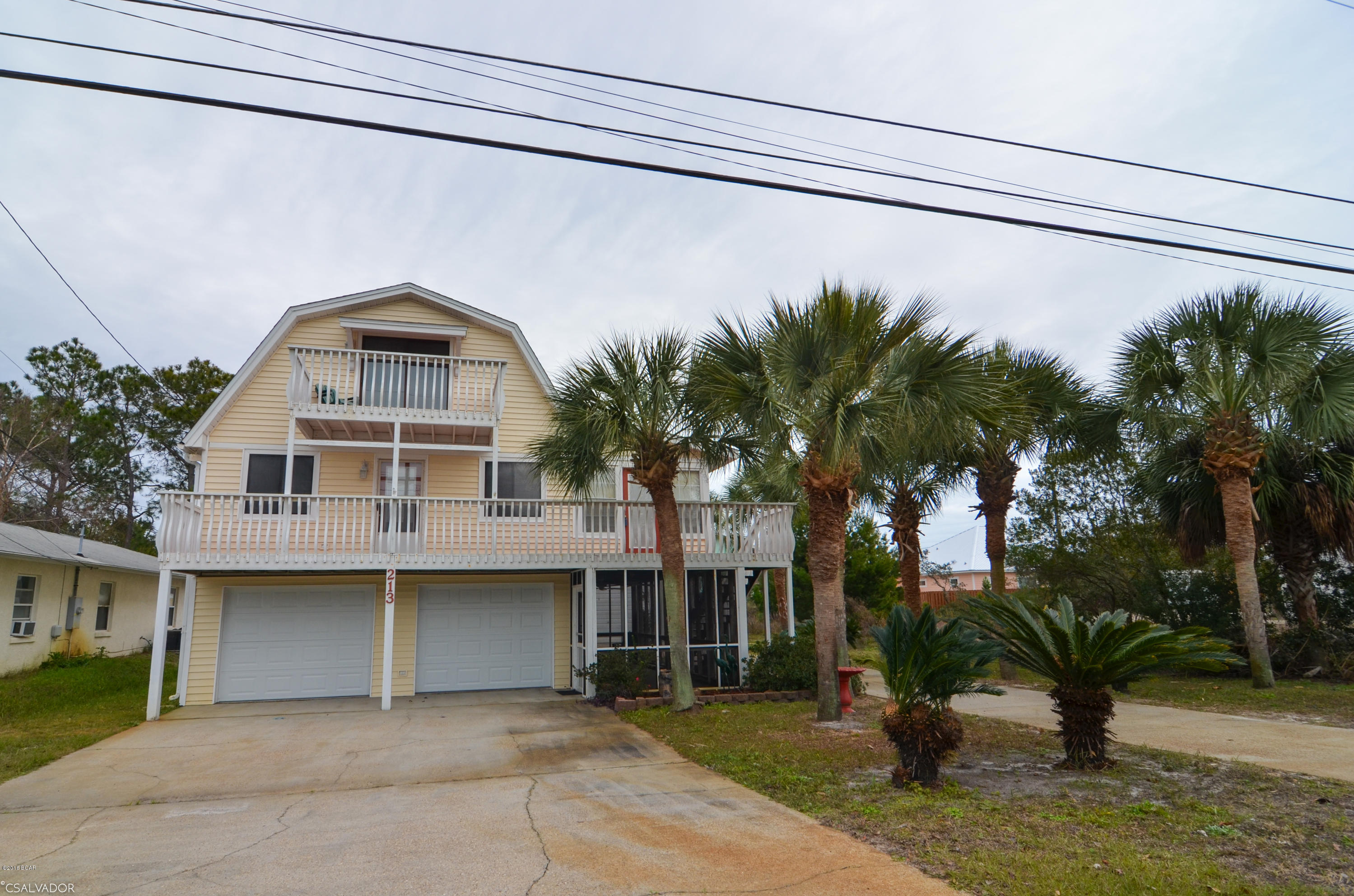 Do you have toys? This is home is for you! There are 3 garages. There is a RV garage an additional boat, golf cart or car garage there is also a heated and cooled attached 2 car garage. What else do you need a pool? You are in luck it has a beautiful in ground pool. There is a screened in porch, Florida room many decks and there is a brand new roof on the home and the garages. Want more? This home is only 2 blocks to a deeded beach access. Grab your swim suite and golf cart and come on.