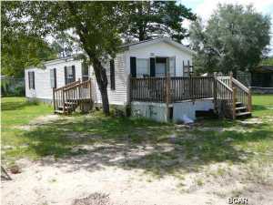 This 2 bedroom 1 bath mobile home is located in the quiet Green Acres Mobile Home Community, on a large lot of property that is fenced. This home features an semi-open floor plan giving the living room, kitchen & dining room an open, spacious feel. Central heat and air, 10x12 deck off of the kitchen entrance. Water & sewage included. Come and experience quiet country living. Pets are negotiable with a non-refundable $150 per animal fee (sorry no dogs). *All measurements are approximate*