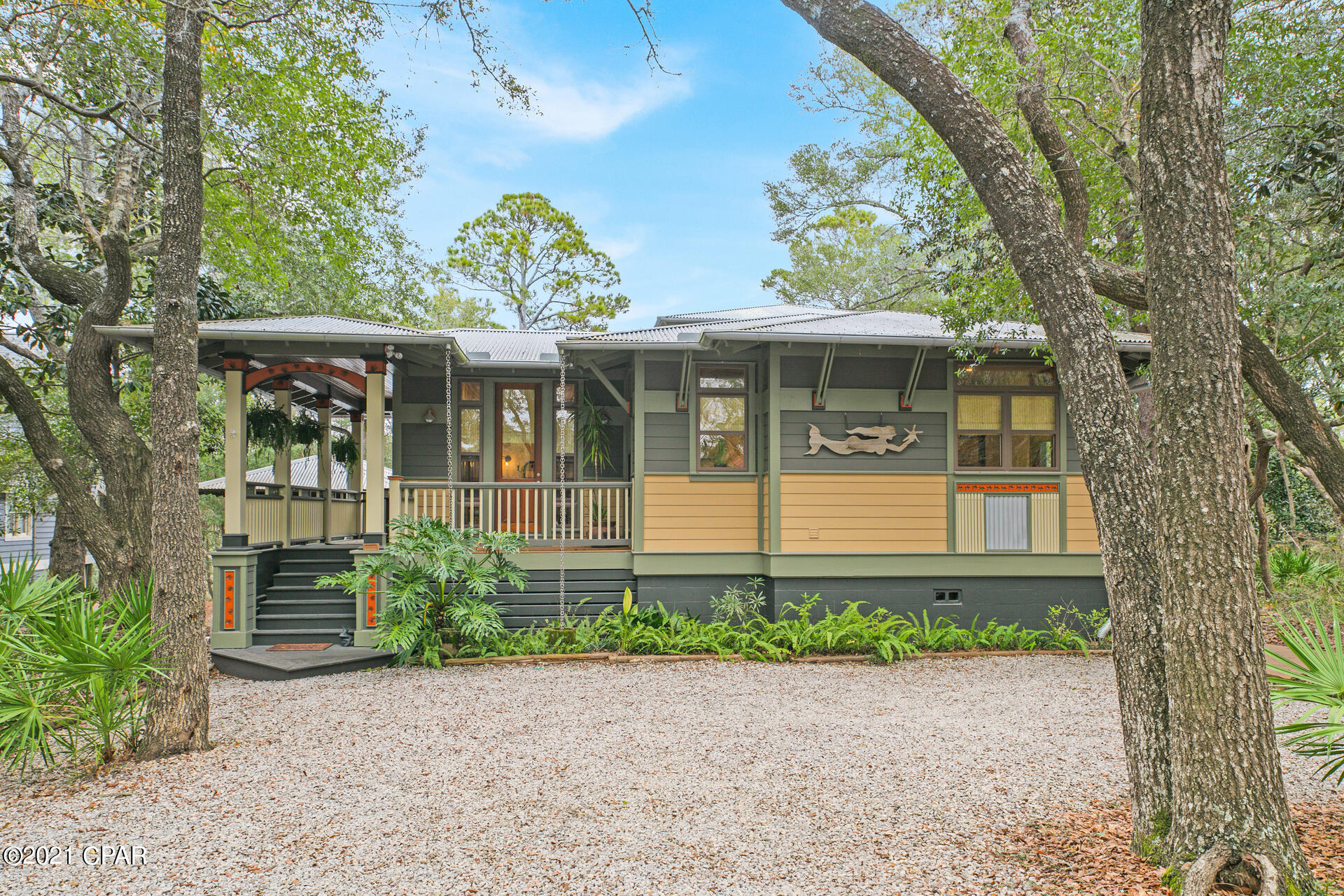 UNDER CONTRACT AND ACCEPTING BACK UP OFFERS. Welcome to Casa sul Canale! This custom-built home sits in a 300+ ft deep, heavily wooded, private setting on Western Lake canal; one of the largest lots on Canal Street. With its Old Seagrove location, it provides easy access to public beaches, Seaside, Watercolor, and 30A. This gorgeous home was carefully designed and built in the Craftsman style architecture with incredible attention to detail and quality craftsmanship. The main house showcases one-of-a-kind details: 200-year-old heart pine floors, doors and trim from New Orleans' reclaimed cypress, and stained-glass transom windows. Floor-to-ceiling windows flood the interior with light. A fireplace with wrap around mantle and hearth, custom window seats, and a tongue-and-groove vaulted ceiling highlight the living area.