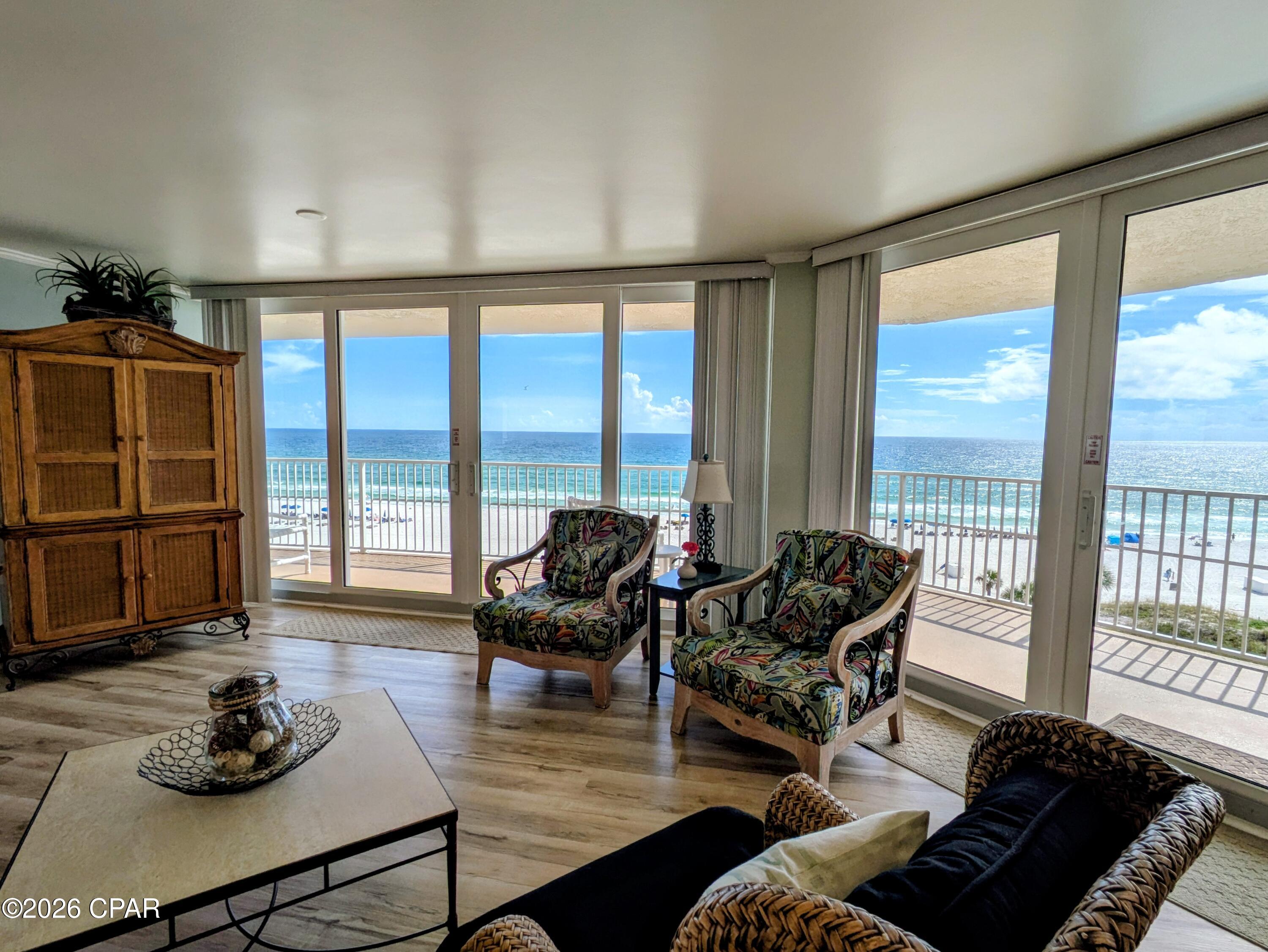 Dunes of Panama E601 stands out from the rest!  Gorgeous and beautifully updated 1,975sq.ft. Gulf front condo with 3 bedrooms and 2 bathrooms, plus an oversized wraparound balcony and an additional private balcony for the 3rd bedroom!  Great rental property currently on the Dunes of Panama rental program or live in your own piece of paradise.  Fabulous million-dollar gulf front views from all three bedrooms, living area and kitchen!  Beautifully tiled showers, wood look LVP flooring throughout, large kitchen with custom countertops, tiled backsplash, and white appliances. 
The Dunes of Panama Resort has 1500 linear feet of sugar white sand, 3 gulf front pools (one heated), four pickle ball courts, one tennis court, free WI-FI, fitness room, shuffleboard, outdoor BBQ grills, Stingray's restaurant and gift shop and the Sneaky Tiki poolside. All Milestone report repairs are completed and ALL assessments have been paid! All dimensions and information herein are deemed reliable but should be verified by buyer.
*Appliances and AC 2018, new UV Light in AC system fall 2023, new dishwasher 2024, new dryer in 2025.