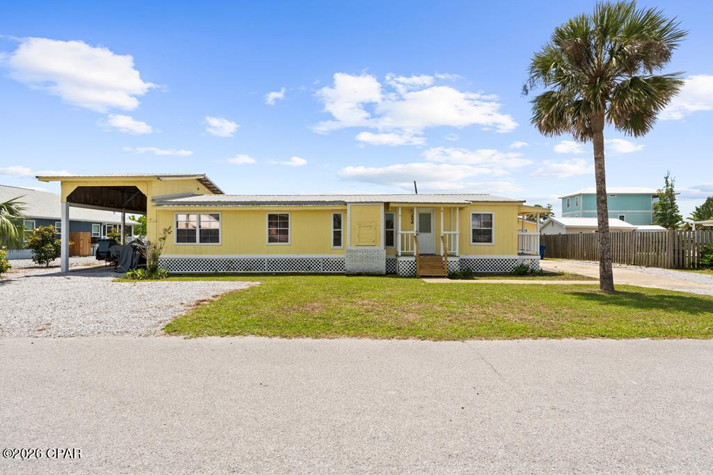 Just two blocks from the Gulf, 204 Carolina Dr is the kind of Mexico Beach property that's getting harder and harder to find. This 3BR/2BA manufactured home offers 1,428 sq ft of living space on a quiet street and sits on a spacious 100x112 lot with tons of room for all your beach and boating gear. If you're a fisherman or boater, you'll definitely want to see this one, featuring a detached garage, additional storage shed, and an enormous boat barn with room for a 30+ ft boat so you can keep everything covered and ready to hit the water at a moment's notice. Out back, you've got both a screened porch and an open porch overlooking a large backyard with plenty of space to relax or entertain. Inside, the home features a large living area, oversized master bedroom, and spacious master bath with a generous closet. The hard stuff is already in place here, and the property is ready for the next owner to come make it their own, whether that's a primary residence, second home, weekend fishing retreat, or investment property. Properties in Mexico Beach with this much storage, yard space, and proximity to the beach at this price point are becoming increasingly rare. Call today!