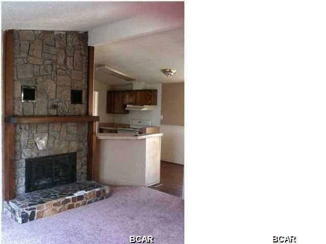 This 3 bedroom 2 bath doublewide mobile home features: nicely sized living room with a built in nook that would be perfect for your computer, stone fireplace, additional den area, kitchen equipped with refrigerator, stove/oven & dishwasher, plenty of cabinet space, separate dining area open to the living room, central heat & air. Master bath has a large mirrored vanity with plenty of counter space. Washer & dryer included. This home must be seen in person to appreciate. Centrally located in Lynn Haven. Some pets are negotiable with a $150.00 non-refundable animal fee per animal - No dogs.