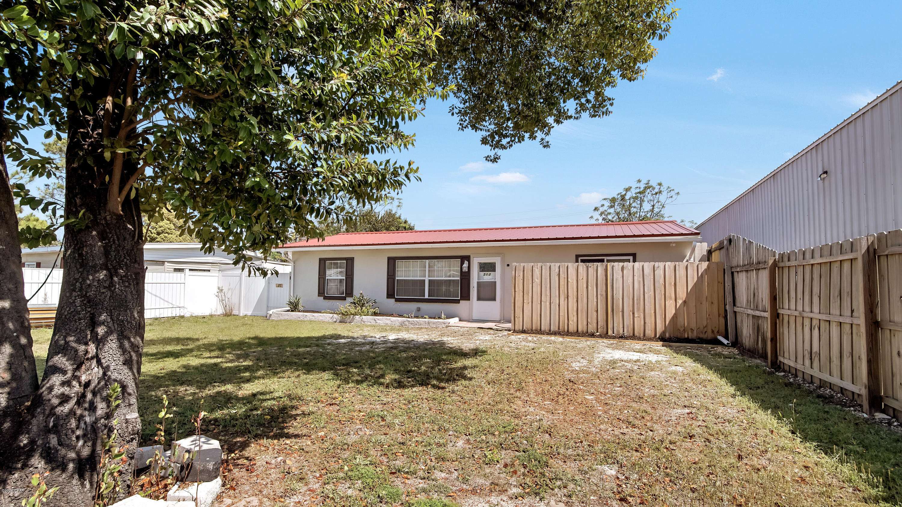 Video and Virtual Showings are Available! This adorable 3 bedroom, 2 bath, bungalow has everything!  New Paint, New Kitchen Cabinets, New Appliances, Small Fishpond in the backyard, Vinyl fence, huge lot big enough for RV storage and comes with sewer line and 30 AMP hookup, Pavers, Close to Public Beach Access 44 & 45. Zoned residential and commercial! No limits on short term rentals or business usage.
