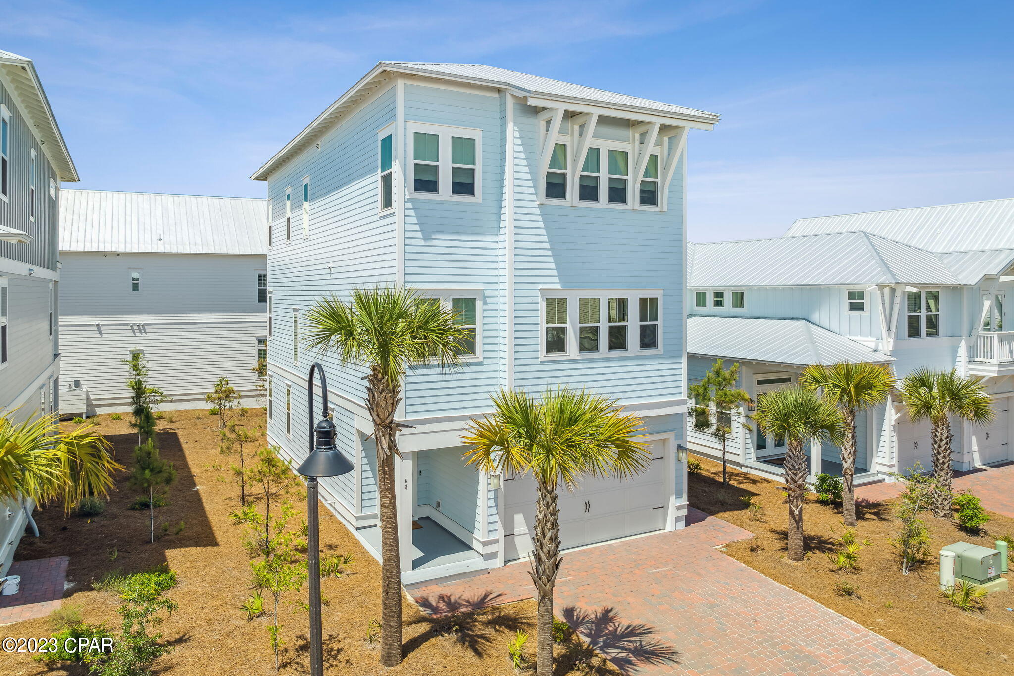 This coastal retreat is a beautifully decorated and well-crafted home, perfect for those who appreciate Southern living and beachside relaxation. The home's features, including shiplap and crown molding, 8ft doors, and 10ft ceilings, suggest attention to detail and high-quality craftsmanship. The large windows and porches on all three levels offer plenty of natural light and opportunities to enjoy the beautiful views. Additionally, the elevator provides easy accessibility to all three floors, making it an ideal home for those who require or prefer mobility assistance. This 4-bedroom beach house has two master suites, one on the first floor and one on the third floor, offering flexibility and privacy for residents or guests. The Chef Inspired kitchen and expansive Great Room are perfect for hosting gatherings of friends and family. The home is also offered fully furnished, making it move-in ready and convenient for those who prefer not to worry about furniture and decor. The Prominence community offers many amenities, including resort-style pools, a fitness center, and a shuttle service to the nearby Deer Lake Park Beach Access. The location of the home is ideal for those who enjoy dining out, shopping, and entertainment, as it is within walking distance of The Hub, a popular destination for all of these activities. Additionally, the home is just a short walk from the members-only Watersound Beach Club, making it an excellent choice for those who value access to exclusive amenities.