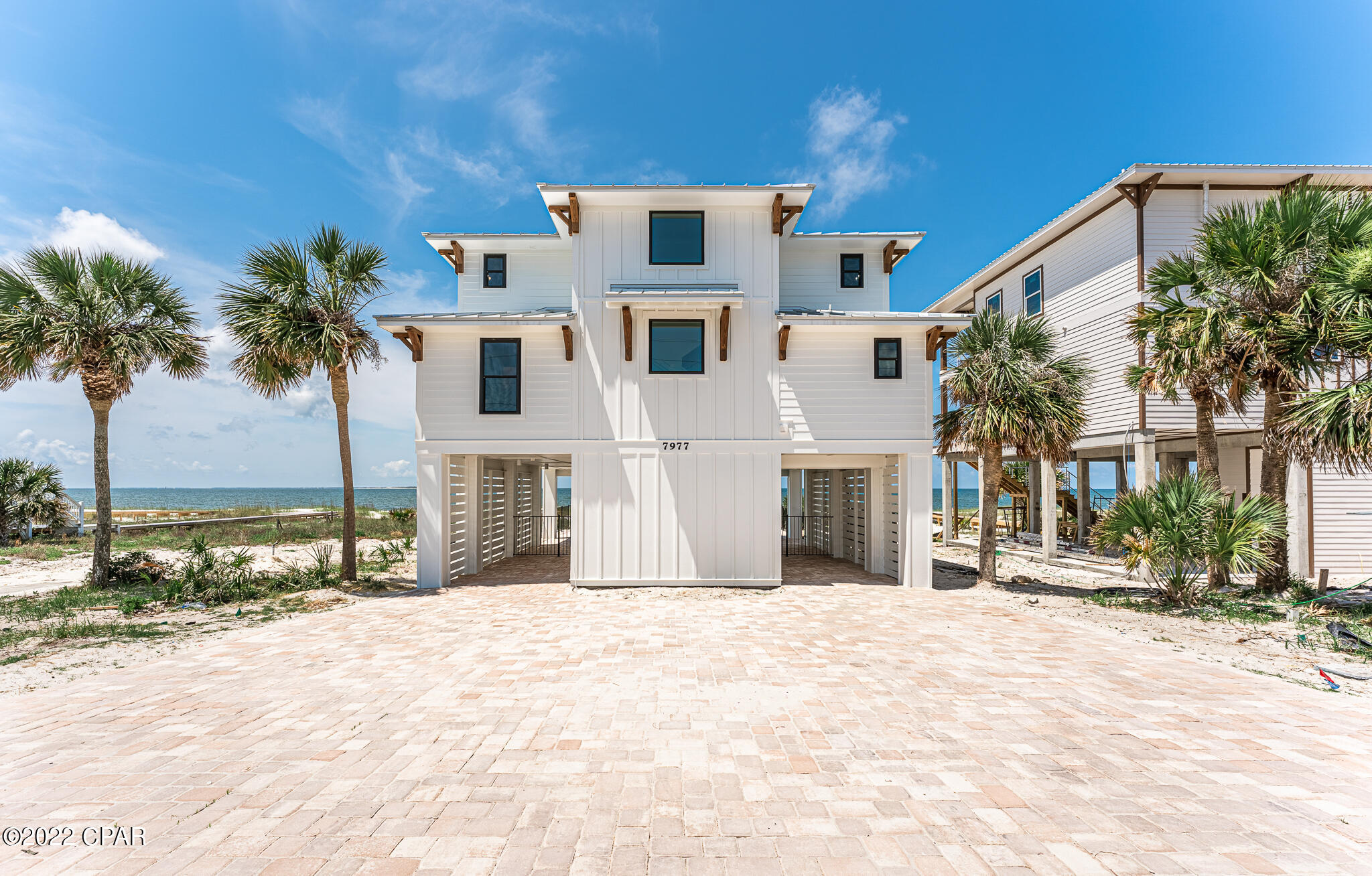 Incredible beachfront home that has been completely remodeled by Blackfin Construction. Great pool & bar/outdoor kitchen area overlooking the beach with a private boardwalk. The 2nd floor has 2 BRs including a bunk room and open kitchen with Thor appliances/granite countertops & a convenient butler's pantry off the main kitchen. The 3rd floor features 3 additional bedrooms that each have their own full bathroom. Each floor opens up to a large deck with great views of the gulf. Rental projection of $192k from Cape and Coast. This is one of only two homes for sale on the beach from Mexico Beach to St. Joe Beach & the other is $3.79M. Currently, the least expensive gulf front lot on the market is $1,199,000 & you'd be lucky if you bought a beachfront lot and had it permitted and a home built within 2 years. Check out the virtual tour.