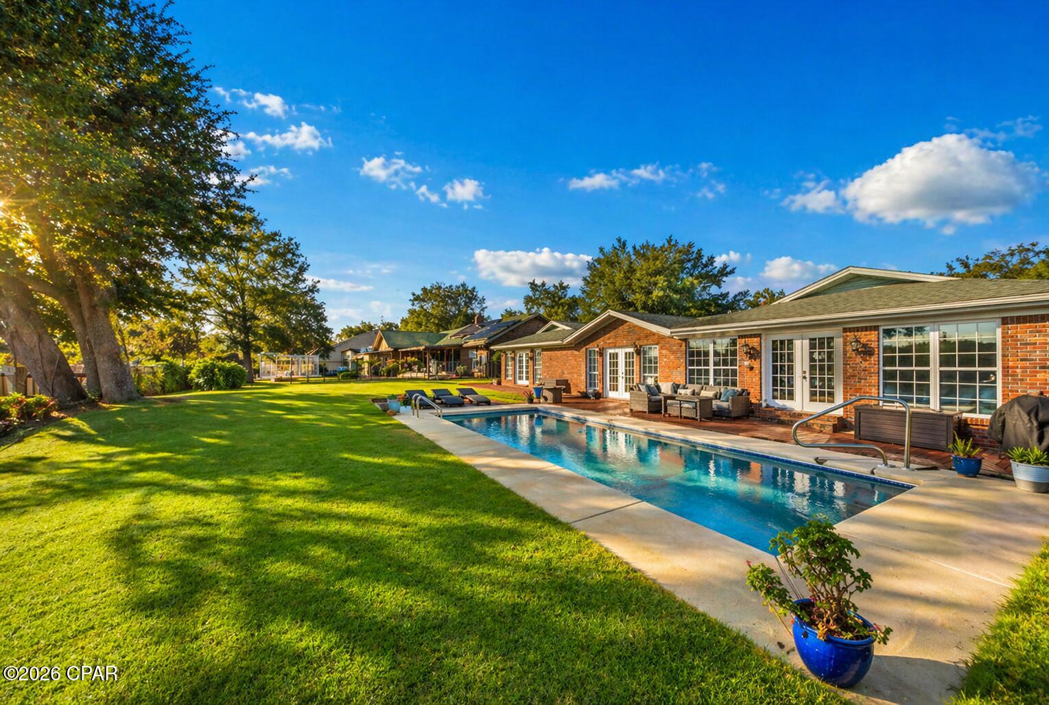 Welcome to this beautifully renovated 4-bedroom, 2-bath waterfront home offering the perfect blend of modern updates, coastal charm, and true Gulf-access living. With 100 feet of water frontage, a private boat dock, and a boat lift, this property is ideal for anyone who wants to enjoy life on the water. 

Step inside to find updated flooring, fresh interior paint, and a bright, airy layout filled with coastal vibes. The kitchen has been recently upgraded with modern cabinets, sleek countertops, and newer appliances, delivering both style and function.

The spacious master suite features a generous walk-in closet and plenty of natural light, creating a peaceful retreat. Additional highlights include newer lighting throughout, making every space feel refreshed and inviting.

Outside, enjoy your own backyard oasis with an inground pool installed in 2022, perfect for entertaining, relaxing, or cooling off after a day on the water.

Located close to shopping, restaurants, schools, churches, and Tyndall AFB, this home offers incredible convenience while providing the coastal lifestyle buyers are searching for.

Move-in ready, updated, and on the water, this one truly has it all!