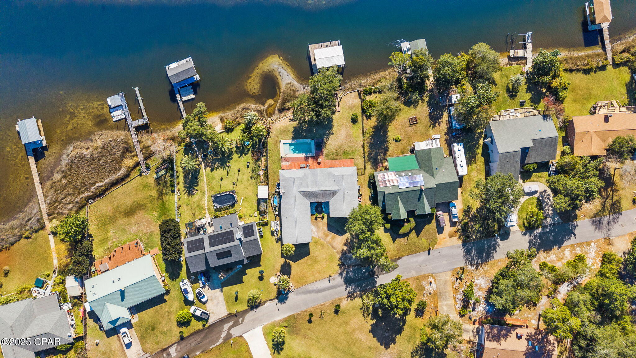 Welcome to this beautifully renovated 4-bedroom, 2-bath waterfront home offering the perfect blend of modern updates, coastal charm, and true Gulf-access living. With 100 feet of water frontage, a private boat dock, and a boat lift, this property is ideal for anyone who wants to enjoy life on the water. 

Step inside to find updated flooring, fresh interior paint, and a bright, airy layout filled with coastal vibes. The kitchen has been recently upgraded with modern cabinets, sleek countertops, and newer appliances, delivering both style and function.

The spacious master suite features a generous walk-in closet and plenty of natural light, creating a peaceful retreat. Additional highlights include newer lighting throughout, making every space feel refreshed and inviting.

Outside, enjoy your own backyard oasis with an inground pool installed in 2022, perfect for entertaining, relaxing, or cooling off after a day on the water.

Located close to shopping, restaurants, schools, churches, and Tyndall AFB, this home offers incredible convenience while providing the coastal lifestyle buyers are searching for.

Move-in ready, updated, and on the water, this one truly has it all!