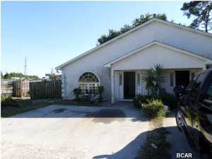 Great rental property investment! Close to beach and shopping, centrally located for any interests. This 2 bedroom 2 bath, 1/2(half) of Duplex is located on Panama City Beach, Built in 2001, stucco siding. Large back yard to enjoy. Concrete Parking pad, Central AC/Heat, stove, Refrigerator, dishwasher, washer, dryer, and microwave included. Ceramic tile floor in kitchen Bathrooms and living room, wall to wall carpet in bedrooms. Duplex in great condition, near the beach. Has been newly painted inside and out. Unit is currently occupied. Shared septic system is in neighbor's yard. Unit has been well maintained and managed. Tenants pay all their utilities except yard maintenance. Great opportunity as an investment. Values are starting to go up. Listing agent is owner of property and