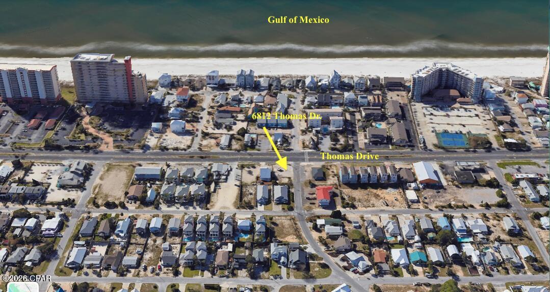 CORNER LOT ALERT with 50' of frontage on Thomas Dr. with 120' on Holiday Dr.  Currently has an ice vending machine on it (will be removed before closing if desired).   Close to two beach accesses on Gulf Dr.  High & Dry - Flood Zone X.