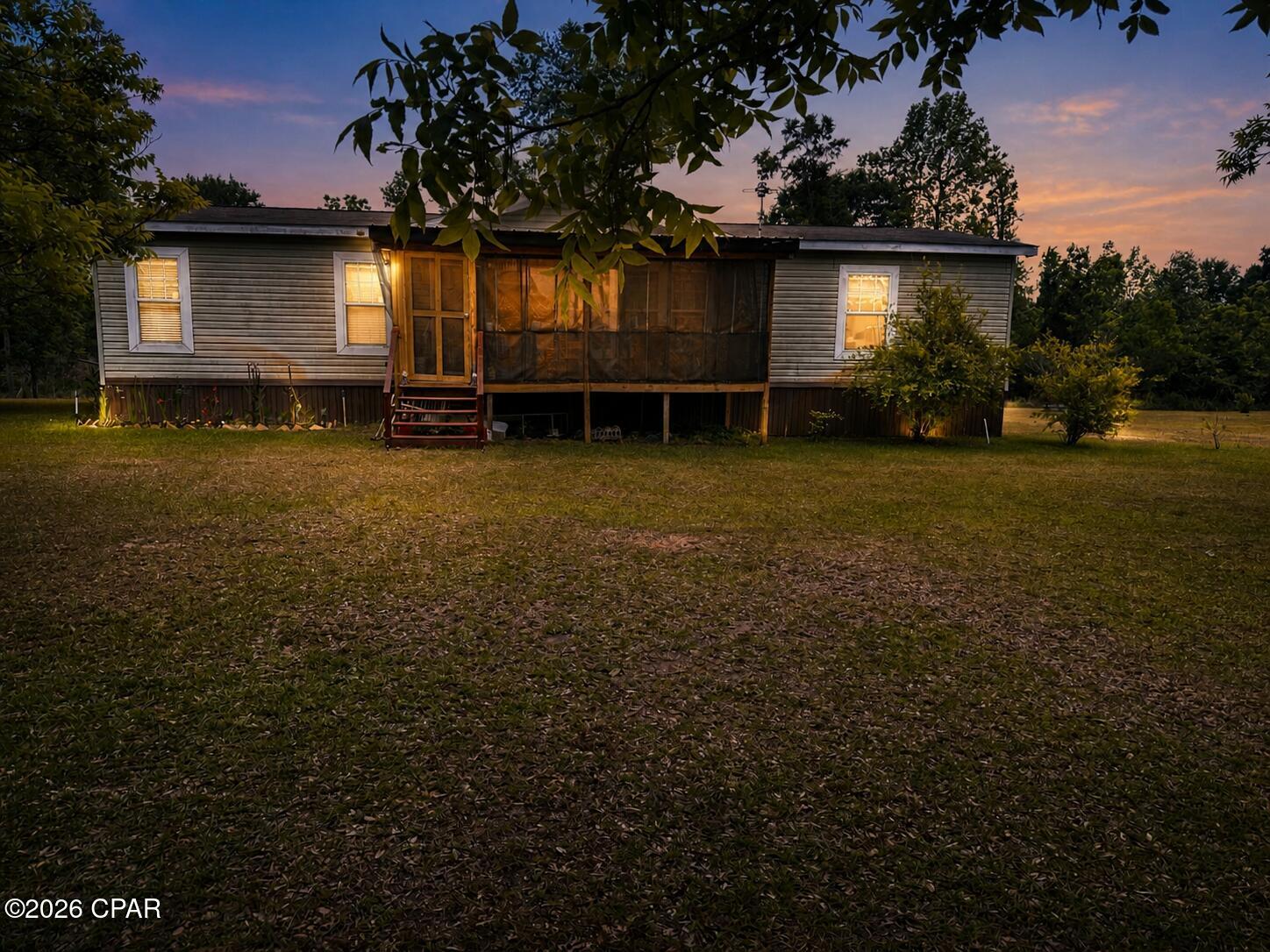 Welcome to a place where life slows down just a little!

Tucked away on just over 3 acres, this 3 bedroom, 2 bathroom manufactured home offers the kind of space and simplicity that's getting harder to find. From quiet mornings with coffee on the screened-in porch to evenings spent watching the sunset with the sound of crickets in the background, this property invites you to settle into a slower, more intentional way of living.

There's room here for it all! Everything from weekend fires under the open sky, a garden, chickens, or whatever version of homestead living you've been dreaming about.

Inside, the home offers a comfortable layout with just the right amount of space, while outside is where this property truly shines with wide open land, privacy, and the freedom to make it your own.

If you've been looking for a place that feels peaceful, grounded, and full of possibility... this might be the one!

On the property you'll also find blackberry bushes, pecan trees, three pomegranate trees, a fig tree, rosemary bushes, oregano, and sage!