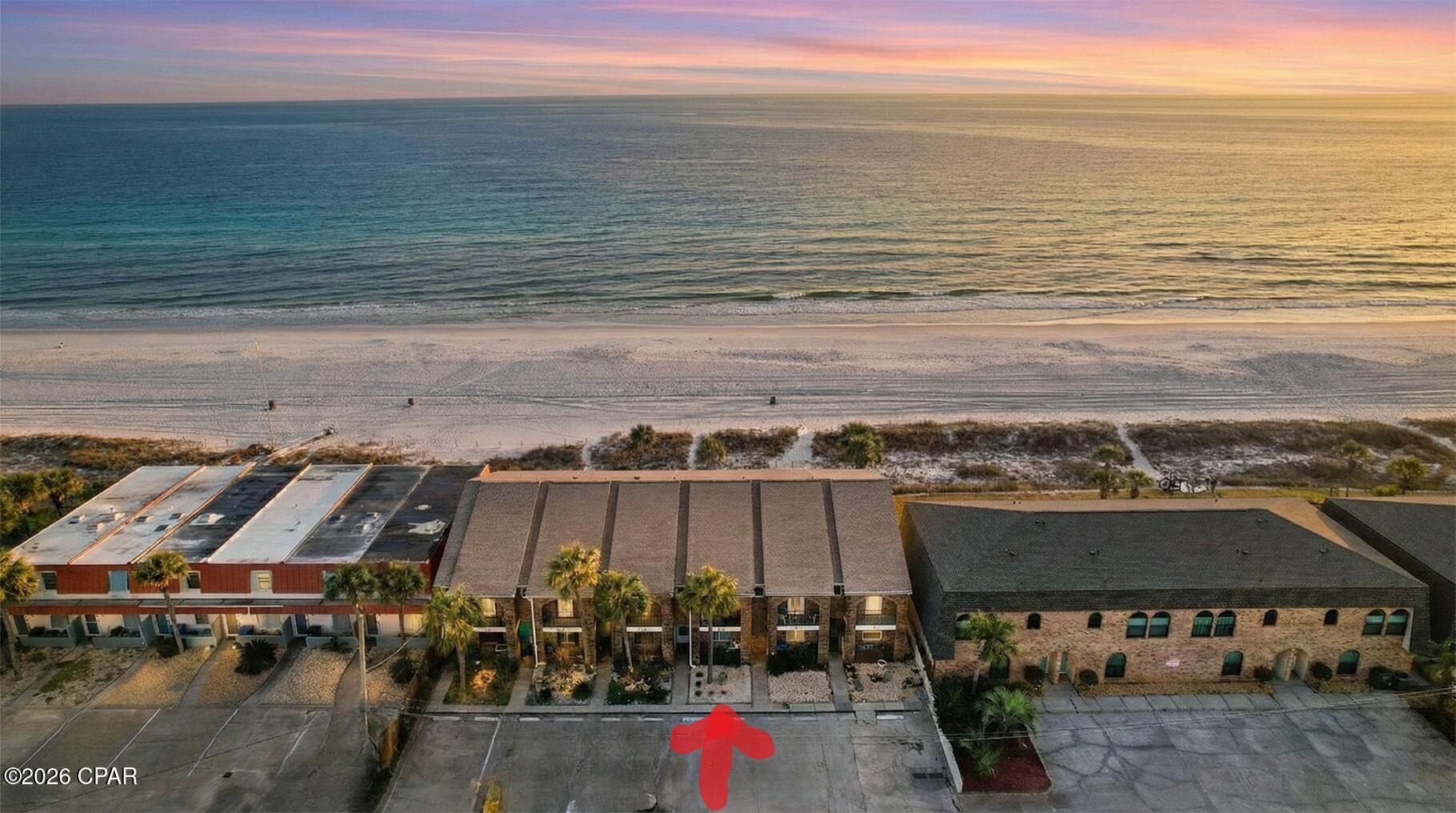 NO HOA fees, lower property taxes, and two reserved parking spaces right at the front door--a combination that's tough to find on the Gulf.front where your beach day starts the moment you open the door. This rare 3BR/3BA townhome delivers the best of both worlds: a private, low-density beachfront getaway with the upside of strong rental appeal in one of Panama City Beach's most coveted stretches of sand.

Inside, enjoy an open-concept main level designed for effortless coastal living, with generous natural light and seamless flow to Gulf-front outdoor entertaining space--perfect for sunrise coffee, sunset dinners, and salty breezes on repeat. A main-level bedroom and full bathroom adds flexibility for guests, while upstairs the Gulf-front primary suite feels like a true retreat with private balcony views. The additional bedroom and bath provide comfortable space for family and friends.
Whether you're buying for lifestyle, income potential, or both, this home checks the boxes: direct beach access, unforgettable views, and a location that feels tucked away--yet close to the best of dining, shopping, and entertainment.