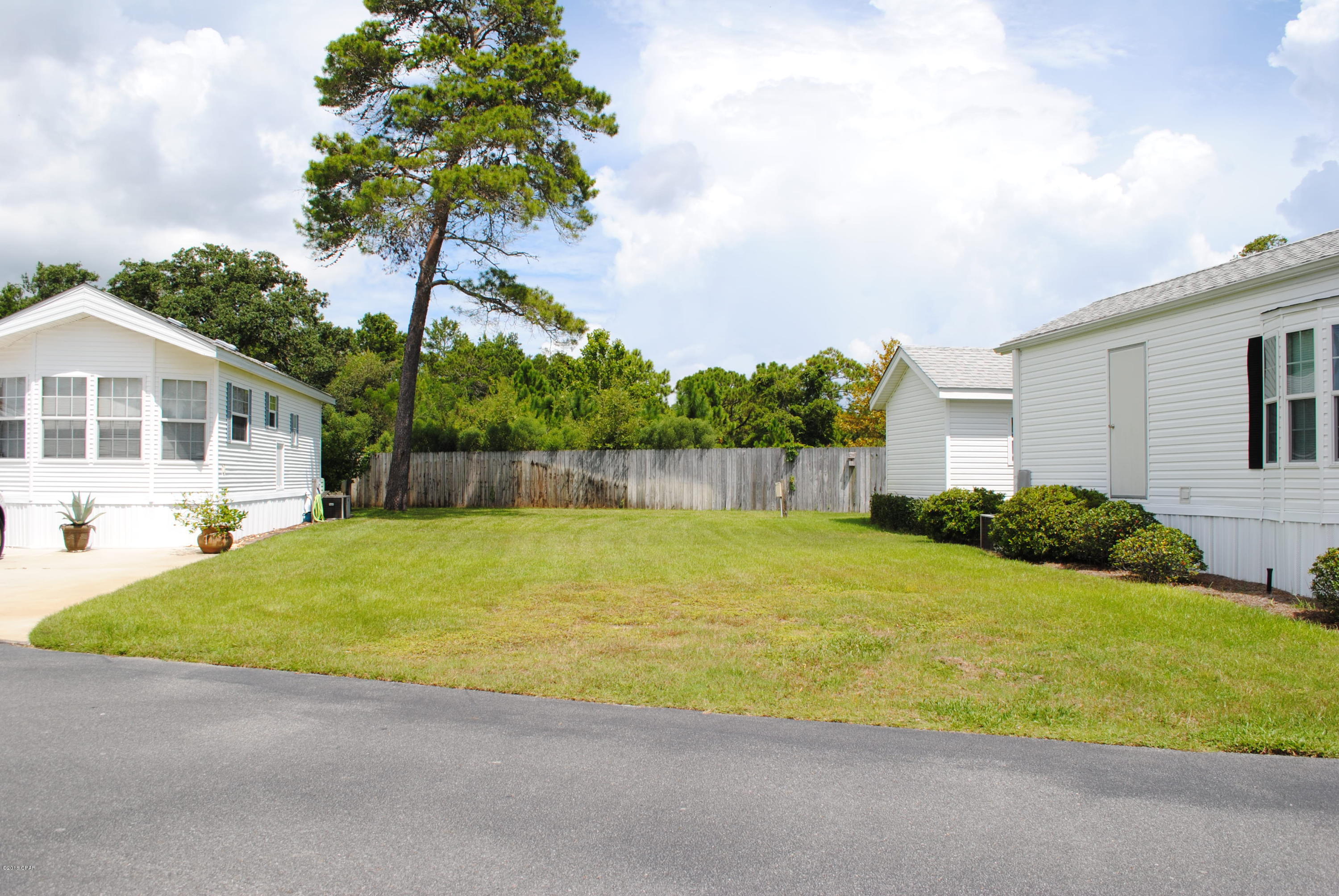 OWNER IS READY TO SELL! One of the few remaining lots available at Emerald Pointe Resort without plans to be developed. This lot is located in the gated community of Emerald Pointe Resort, which is conveniently located near restaurants, retail shopping and the beach. The community offers a large clubhouse with a full kitchen, exercise room, 2 pools (1 heated seasonally), hot tub, lake with boardwalk, playground, and shuffleboard court. If you like to fish or just want to take a relaxing stroll, then you will enjoy the boardwalk that surrounds the lake and water fountain. Whether your looking for a place to call home or an investment property, you will want to see this one. HOA Fees Includes: WiFi at Clubhouse, water, sewer, garbage, cable, and lawn service.