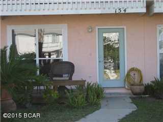 JUST A SHORT WALK TO THE BEACH. NICE VIEW OF THE GULF FROM BOTH UPPER & LOWER DECK.NEW A/C 7/25/15. TILE THROUGHOUT. BEDROOMS CARPET.GRANITE COUTER TOPS KITCHEN & BATHS. NEW RANGE & MICROWAVE.NEW WINDOWS FOR GREAT VIEW. BACK YARD TOTALLY DECKED WITH HOT TUB & GAS GRILL.