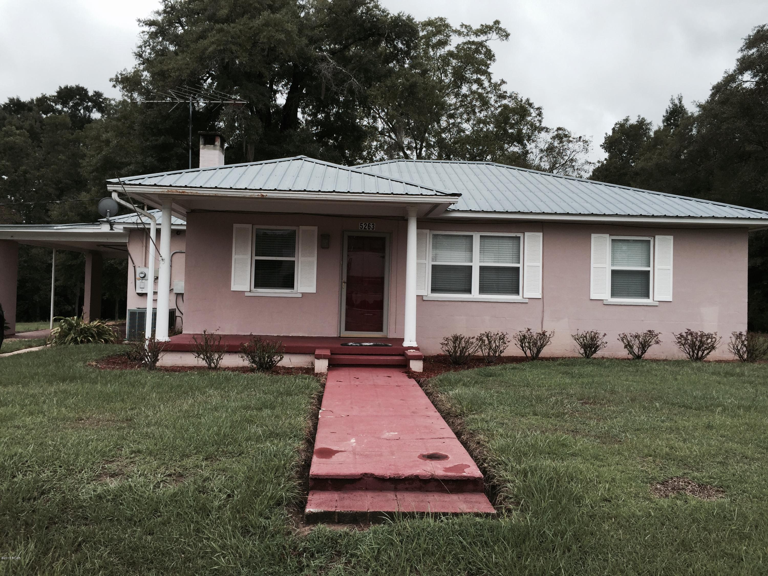 A very nice area downtown close to all shops. Just put in new carpet, vinyl in kitchen, painted cabinets and new countertops in kitchen as well. This is a quaint 3 bedroom home which features a fireplace in the living room, a whole house fan, central heating and air conditioning, newer stove and microwave, double paned windows with a metal roof. The land has beautiful shade trees and a nice screened in back porch to enjoy, fruit trees and pecan trees and a creek that runs along the back of the property line that also has a nice size shed in the back with a covered carport. Motivated seller